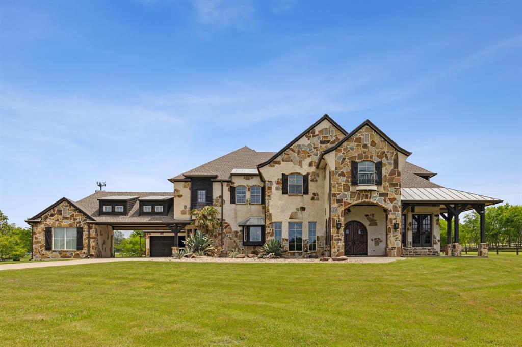 Private Gated 12 Acre AG Exempt property in Rockwall County. Upon entering this property you will drive down the tree covered driveway bordered by two ponds. This exquisite setting is ideally located in the thriving Rockwall County. Built in 2004 this gorgeous home is ideal for entertaining with many amenities! This 4 bedroom,4 and a half bath, 3 car garage, also boasts of a media room, exercise room, game room, study, pool, outdoor kitchen, pool bath, 2 fireplaces, ponds, 25 x 50 equipment shed and a 30 x 35 shop. The outdoor space is also ideal for entertaining with covered spaces and outdoor kitchen overlooking the pool.  A 6 stall barn, dressage arena, practice field and open land make this the ideal home for horse lovers and competitors.