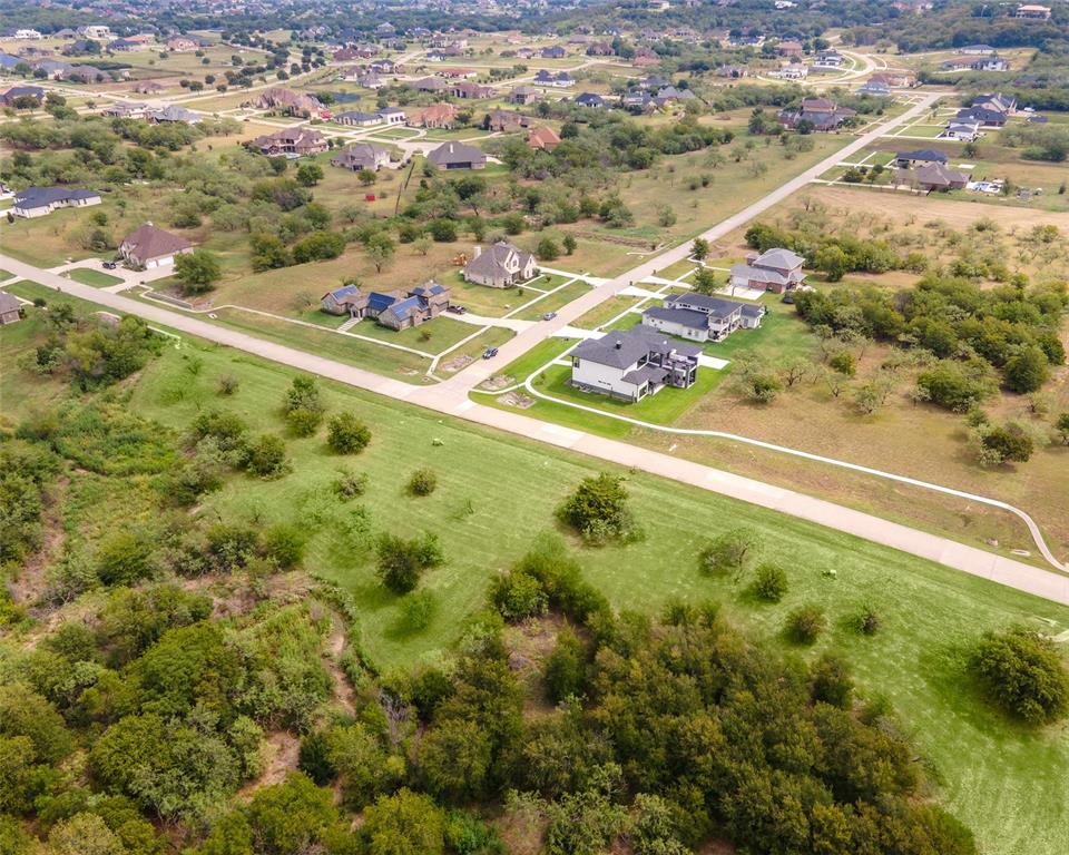 An exceptional opportunity awaits in the scenic Lake Ridge community—this expansive 2-acre offering (a rare double lot) delivers sweeping views of open land and the freedom to create the home you’ve always imagined. Purchase a single lot for $165,000 or secure both for $330,000; the seller is open to subdividing with an acceptable offer, giving you flexible options to fit your vision. Bring your preferred builder and take your time—there’s no deadline to break ground. Located in the Midlothian ISD, this home site combines natural beauty with everyday convenience. Enjoy access to outstanding neighborhood amenities including Tangle Ridge Golf Course, Valley Ridge Park with a stocked fishing pond and pier, a 1.5-mile paved trail, playgrounds, sports fields, and multiple parks woven throughout the community. Outdoor enthusiasts will love being just minutes from Joe Pool Lake, Lynn Creek Marina, and Cedar Hill State Park, while everyday errands are a breeze with the new HEB only about 20 minutes away. Whether you’re ready to build now or planning for the future, this is a rare chance to secure prime land in one of the area’s most sought-after settings. Schedule a visit and walk the property—once you see the views in person, you’ll understand the possibilities.