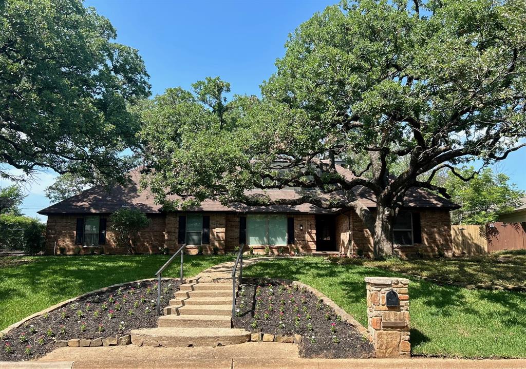 Too good to be true!! Stunning home located in highly sought after Arlington neighborhood that borders Pantego. The WOW Factors on this beauty start with the curb appeal which features towering trees, lush grass, and beautiful landscaping. Once inside, you’ll find unique feature walls, wood floors, quartz counters, custom cabinets, modern windows, decorative lighting, fresh paint, barn doors, and designer touches throughout. The open concept layout offers a great area to gather with family and friends. Additionally, the three separate living spaces also offer privacy. On the main floor there is a large living area with a cozy fireplace that opens to the kitchen and dining area. Also located on the main floor, there is a media room, office space, laundry room and half bath. The oversized primary bedroom suite is located downstairs as well and includes a spa like bathroom with separate vanities, custom tile shower with glass door, and a dream sized closet. Upstairs there is a generous bonus room with built-in cabinets, two large bedrooms and a Jack and Jill bath. The outside spaces are just as impressive with a huge lot and private backyard. The covered patio offers a great place to relax and enjoy the nature views. There is also plenty of grass, an open brick patio, and a storage shed. This is the PERFECT home, in the perfect location at the perfect price! Don’t miss your chance to be the next lucky owners of 3609 Country Club Drive.
