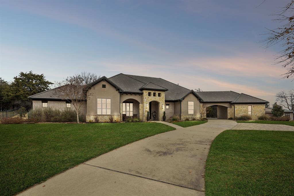 You'll love the country feel close to the city amenities, located in the highly wooded Keller area on the edge of Westlake and Southlake, this executive-level residence offers refined living in one of Keller's most desirable locations-ideal for corporate relocation, executive buyers, and those seeking a move-in-ready luxury home near top-tier schools. This gorgeous custom home is situated on nearly 5 acres, featuring a lush landscape, covered patio, stunning pool, firepit, and outdoor kitchen. This home was thoughtfully designed with daily comfort and a fun lifestyle in mind.  The home has a functional floor plan with soaring ceilings, custom millwork, designer lighting, and walls of windows that bring in natural light. The chef’s kitchen includes commercial-grade appliances, an oversized island, custom cabinetry, and seamless flow to the great room plan. The first-floor primary suite provides a private retreat, a custom closet and “secret” room that connects to the office.  All remaining bedrooms are spacious with ensuite baths.  A dedicated office downstairs and a library upstairs offer flexibility for work-from-home living.   The home also includes a large downstairs gameroom (pool table included) with wet bar and easy access to the outdoor living area.  Attached 2 car garage, Carport, and 3rd car garage through the portico, plus added parking pad.  Zoned for Keller ISD, and just minutes to 114 with access to many amenities.  Entire property is fenced, including an interior fence around outdoor living areas and an electric driveway gate for secure access.  This property also includes a 22'x22' unattached permanent utility building with a sliding garage door.