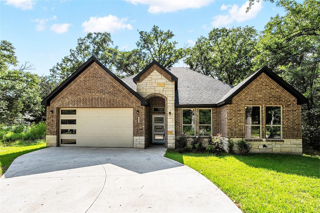 Brand-New Lake Community Home – Never Occupied

Experience the opportunity to own a pristine 2023-built home that has never been lived in, located within a sought-after gated community on Cedar Creek Lake. This thoughtfully designed 3-bedroom, 2-bath residence offers a desirable split-bedroom floor plan, combining privacy, comfort, and modern style.

The spacious open-concept layout features a large living area anchored by a cozy wood-burning fireplace, creating the perfect gathering space for family and friends. The kitchen is designed for both everyday living and entertaining, offering an oversized island, abundant cabinetry, a large walk-in pantry, and a refrigerator that conveys with the home. French doors lead to the covered back patio, extending your living space outdoors and providing a great setting for relaxing or entertaining.

The private primary suite is a true retreat, featuring a generous walk-in closet with built-in shelving, dual sinks, and an oversized walk-in shower. Tile flooring flows throughout the main living areas for easy maintenance and durability, while the bedrooms offer the comfort of carpet.

Outside, enjoy a beautifully landscaped yard with lush grass and attractive curb appeal. Beyond the home, residents enjoy an exceptional array of community amenities, including a swimming pool, clubhouse, playground, tennis courts, lake swimming area, park with outdoor grills, boat ramp, and access to all that Cedar Creek Lake has to offer.

Whether you're looking for a full-time residence or a weekend lake getaway, this move-in-ready home offers the rare combination of new construction, quality finishes, and outstanding community amenities.
