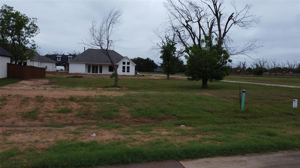 Rare opportunity to own a beautiful .292-acre corner lot in the prestigious, gated community of Pecan Plantation. This level homesite is the perfect canvas for your custom build, offering the added space and privacy that only a corner position can provide. Enjoy an unmatched resort lifestyle with access to two 18-hole golf courses, a full-service clubhouse, tennis and pickleball courts, and a private marina on Lake Granbury.
The monthly HOA fee provides an incredible value, covering 24-7 gated security, common area maintenance, and convenient trash pick-up. With no immediate timeline to build, you can secure your piece of Texas paradise now and design your retreat at your own pace. Residents also enjoy the Village shopping center, featuring a grocery store, pharmacy, and bistro—all accessible by golf cart or a short walk.