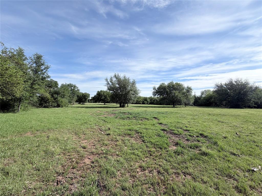 A secluded 3.25-acre tract located within the city limits of Whitney. Enter from the private chip sealed road into a setting surrounded by dense, mostly evergreen trees providing year-round privacy, while still offering ample open space for building. Lakewood Acres includes a gated entrance, City water, underground electric, and deed restrictions mirroring City of Whitney regulations. Frequent deer and bird sightings enhance the natural setting.
