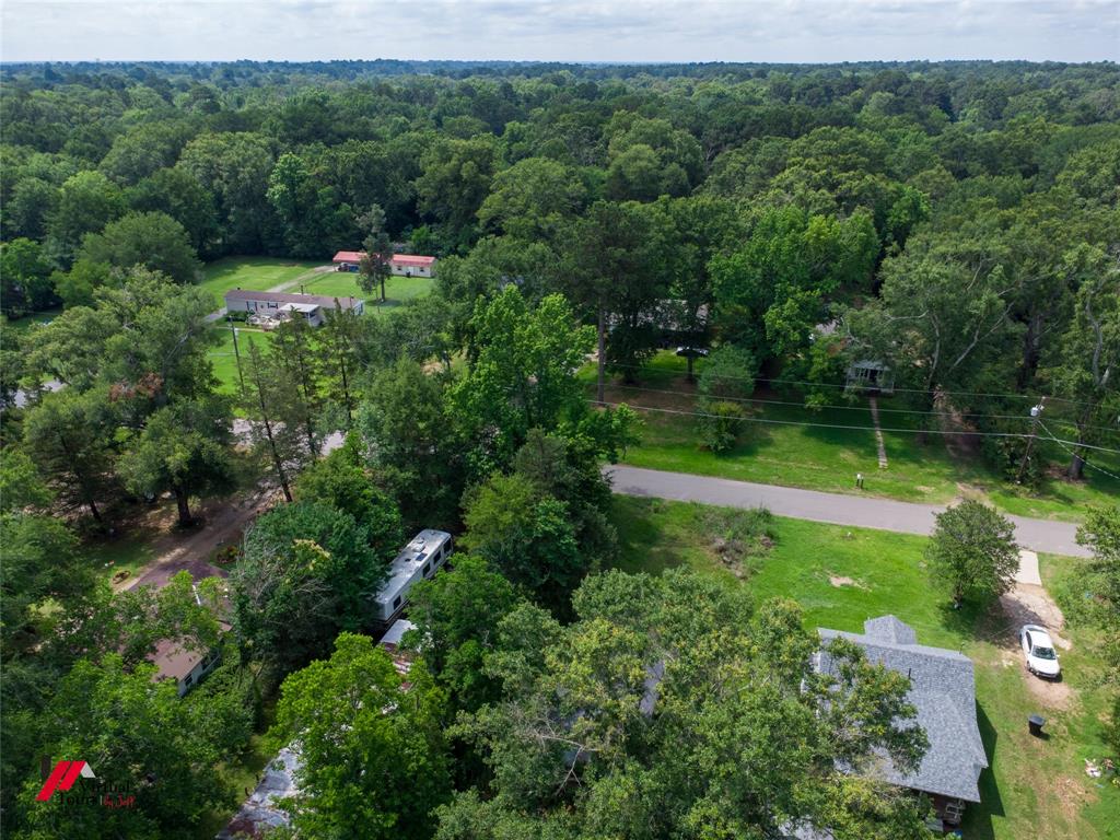 If you are looking for rural living in the city, this is it.  Lot is long and narrow rectangular shaped lot, 50 feet at the street and lot goes all the way back to the railroad crossing.  Little white house on the lot next door is rented.