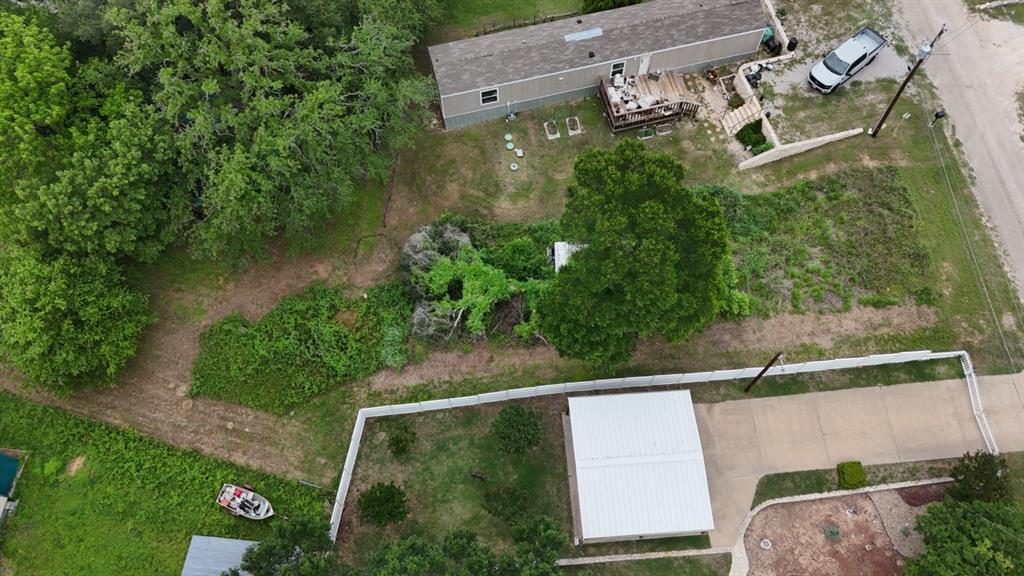 Rare Opportunity: Private River Access in POA Community
Build your dream home on this exceptional vacant lot in a property owner association neighborhood offering exclusive, owner-only river access. This is the setting buyers dream of—privacy, natural beauty, and an established community.
Property Highlights:
• River access Land 
• Ready to Build – Vacant lot cleared and staged for immediate development; no structures to demo
• Utilities at Street – Water, sewer, and electric available at the road. Unknown connection process
• Exclusive Community – POA membership includes private river access restricted to property owners only—a rare amenity that adds significant lifestyle and investment value

Water is with Aqua Water, a water tap is $1,700

Want to sale with the property behind this one. $27,000 for the two. 8165 Deer View Cir, Granbury, TX 76049

POA notes about what can be put here.
480 sq. ft. living space. Porches do not count. 
You can have a RV as long as it has 480 square feet of living space not including any porches. Our 5th wheel is 40 feet long and with our slide outs we have exactly 480 square feet living space. 
You can do a mobile home as long as it fits on your property and again has 480 square feet living space. But you also have to be 5 feet off your back line and 5 feet off both side lines and 25 feet from the center of the road in the front. That is utility easements that the county requires. 
Whoever buys it will have to fill out a permit before they move any kind of house in. Plus they need to provide a picture of the house and draw a plat of how and where it is going to be sitting on the property. And then turn it in to the POA Board to be approved. It's not a big deal but required to move in. move in fee before they can move the home on the property
