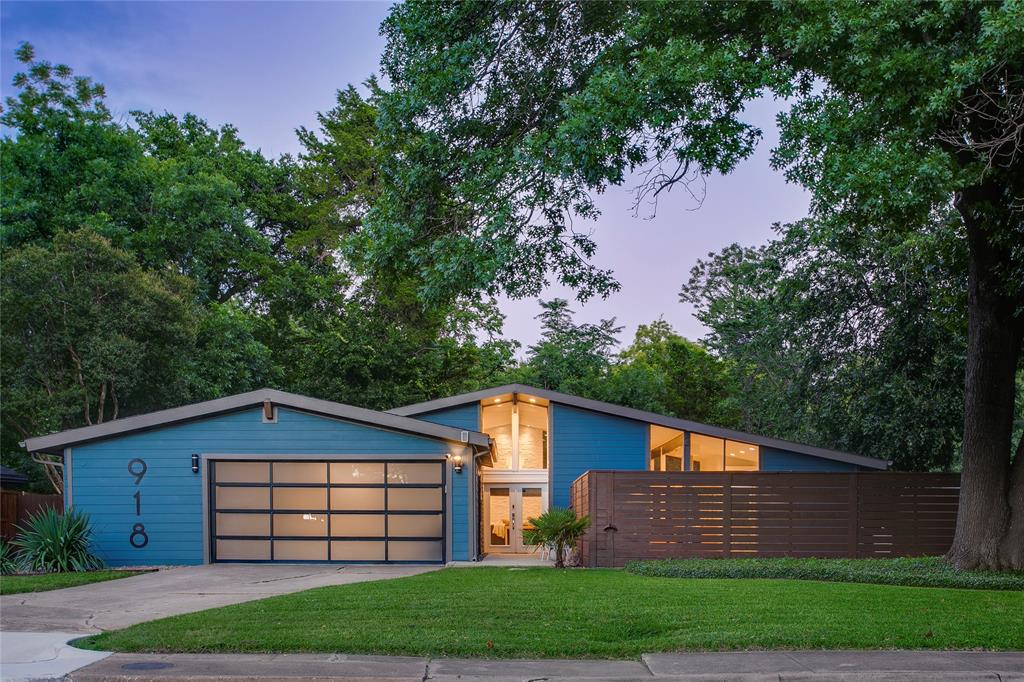 A little Palm Springs, a little Texas, and entirely unforgettable. Tucked among mature trees on a lush creek lot, this rare midcentury retreat feels more like a boutique getaway than a Dallas address. Walls of windows frame a backdrop of greenery at every turn, while vaulted ceilings, clerestory windows, and warm wood beams fill the home with natural light and an effortless sense of calm. Designed for both everyday living and entertaining, the open-concept kitchen, dining, and living spaces flow seamlessly together, all oriented toward tranquil views of the pool and creek beyond. Generously sized rooms and a flexible floor plan offer three bedrooms plus a versatile bonus space ideal for a home office or studio. An oversized attached two-car garage with another bonus space adds even more functionality. Current stewards have thoughtfully invested in the home, completing meaningful improvements including new flooring throughout, updated kitchen countertops and backsplash, fresh interior and exterior paint, turf installation, retaining wall improvements, and extensive updates to the pool and pool equipment. The result is a home that feels both beautifully refreshed and deeply cared for. Outside, the experience only gets better. Whether you're enjoying a quiet morning coffee overlooking the creek, hosting friends poolside, or unwinding beneath the canopy of trees, every space invites you to slow down and stay awhile. Just 10 minutes from Downtown Dallas and moments from parks, walking trails, the Golf Club of Dallas, Dallas Executive Airport, and everyday conveniences, this is the summer escape you've been dreaming of—without ever leaving the city.