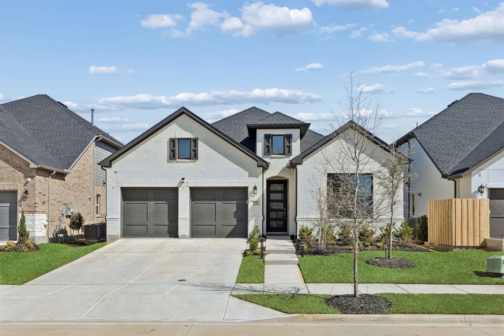 **Fridge, washer, and dryer will convey!** Welcome to 2058 Wimberley Drive in Prosper, located in the highly sought after Light Farms master planned community, where resort style living meets everyday comfort. This beautifully designed one story home is practically brand new and still covered under the builder warranty with Toll Brothers, offering peace of mind along with modern style and thoughtful upgrades throughout. The open concept layout creates a bright and inviting space perfect for entertaining or everyday living, centered around a stunning kitchen featuring Shaker style cabinetry, a beautiful accent color island, extended cabinetry flowing into the dining area, and upgraded countertops, tile, and flooring that bring a polished and cohesive look to the entire home. Designer lighting and additional recessed lighting elevate the space, while practical upgrades include epoxy floors in the garage, painted brick exterior with bronze window trim, and a convenient water softener loop in the garage. A full house water filtration system will convey, along with home security system equipment, adding even more value and convenience. The bathrooms are equally well appointed with stylish finishes and shower niches that add both function and design. Beyond the home itself, Light Farms offers an incredible lifestyle with five resort style pools, more than 240 acres of parks and green space, playgrounds, picnic areas, and over 13 miles of scenic walking and biking trails. Residents also enjoy Constellation Park with its dog parks, dog launch, and 11 acre lake, along with a fitness center and professional level sports courts including tennis, pickleball, basketball, bocce ball, and sand volleyball. The community even features an on site restaurant just minutes from your front door, making it easy to enjoy everything Light Farms has to offer. If you are looking for a home that feels new, offers incredible upgrades, this one truly stands out.