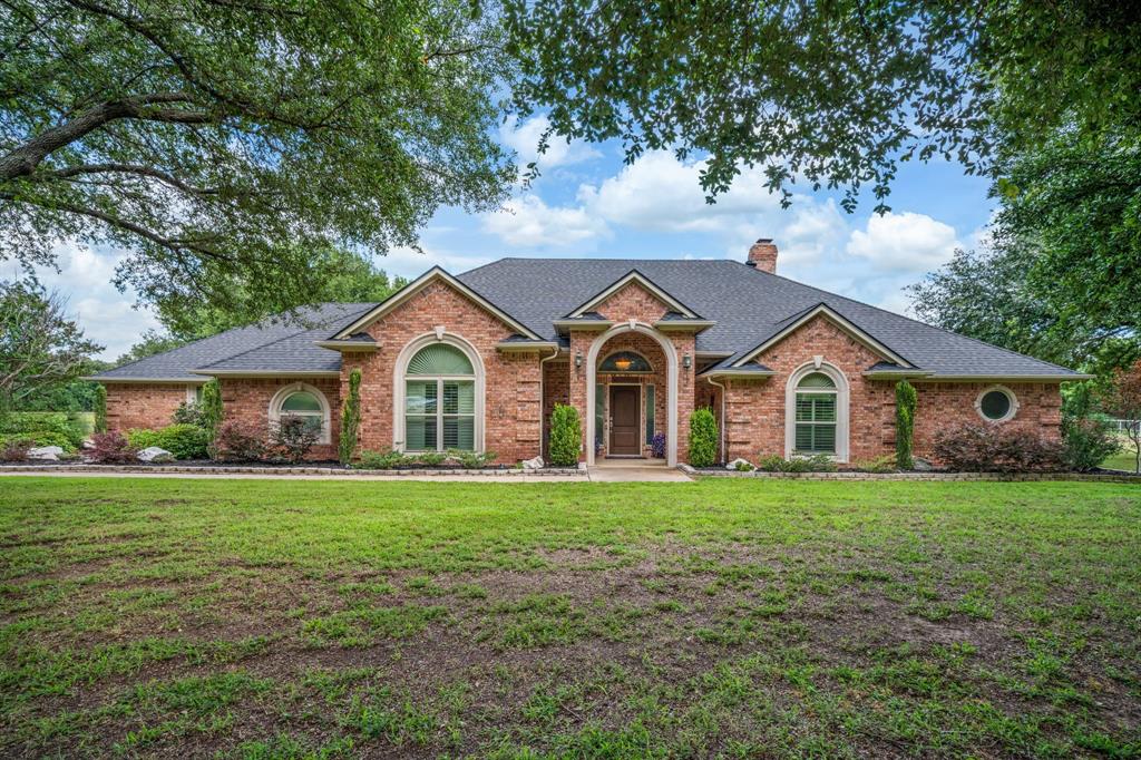 Stunning country retreat in Mansfield ISD on a fully fenced 2.99 acre lot with a picturesque pond and private fishing pier. This updated open concept home features a split-bedroom floorplan and a massive living room with abundant natural light and two gas fireplaces. The remodeled island kitchen offers quartz countertops and flows to casual and formal dining spaces, while hardwood floors run through most of the home. The primary bedroom closet is a room in itself so much space! Additional living space includes a bonus game room and generous secondary bedrooms. Outdoor amenities are exceptional: a resort style pool and spa, covered outdoor kitchen with fireplace and grill, and expansive lawn and pasture areas ideal for family recreation or small hobby farming. Roof is less than a month old! Located in desirable Mansfield ISD, this property offers a rare combination of modern updates, outdoor entertainment features, and nearly three acres of privacy. A MUST SEE!
