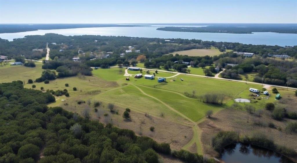 Escape to your private 15-acre recreational paradise, a mere half-mile from the legendary fishing and hunting grounds of Lake Whitney. This unique property features a charming, cabin, providing the perfect basecamp for weekend getaways or year-round peaceful living. With abundant wildlife and quick access to the lake's 225 miles of shoreline, this is an unparalleled opportunity to own your slice of the Texas outdoors. A perfect blend of open pasture, and mature trees along the back of the acreage for privacy, this versatile property is ideal for a homestead or a hobby farm with plenty of room for raising animals and gardening. With minimal restrictions and agricultural zoning, you have the freedom to expand your vision! The acreage offers ample wildlife and natural beauty, perfect for hunting white-tailed deer, turkey, and hogs, or simply observing nature. A cozy, tiny home awaits, offering all the comforts without the fuss. A second, unfinished cabin is also on the property with full utilities. This property isn't just land with a tiny home; it's a lifestyle waiting to be lived. Schedule your private showing today and start making memories by Lake Whitney!