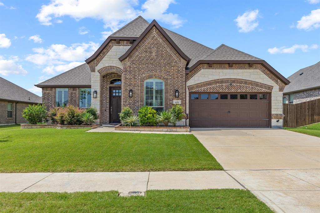 Beautifully upgraded single story home situated on a spacious 70-foot interior lot in the highly sought after North Grove community in Waxahachie. Offering 3 bedrooms, 2.5 bathrooms, a dedicated home office, and 2 living areas, this exceptional home seamlessly blends functionality, style, and sophistication. Designer finishes abound, including stunning high-end light fixtures and chandeliers hand selected by Wesley Wayne Interiors. Premium window treatments feature plantation shutters in the office and formal living room, along with custom motorized shades throughout the remainder of the home. The open concept kitchen is a chef's dream, showcasing a gas cooktop, upgraded vent hood, quartz countertops, abundant cabinetry, and an expansive island perfect for gathering and entertaining. Additional built-in cabinetry and counter space in the dining area provide exceptional storage and serving space. The spacious primary suite easily accommodates a sitting area and offers a luxurious ensuite bath complete with separate vanities, a soaking tub, large walk-in shower, and generous walk-in closet. Step outside to the covered patio, an ideal setting for morning coffee, outdoor dining, or unwinding at the end of the day. Front facing 2 car garage has an epoxy floor coating. Located within walking distance of award-winning Simpson Elementary School, North Grove offers outstanding community amenities including a community pool, multiple parks, scenic walking trails, and basketball courts. Enjoy convenient access to shopping, dining, entertainment, and fitness centers along Highway 77, with an easy commute to downtown Dallas in approximately 40 minutes. Don't miss your opportunity to own this beautifully appointed home in one of the areas most desirable communities. Schedule your private showing today!