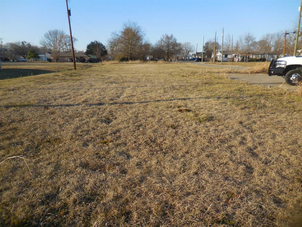 .708 Acre rectangular shaped commercial lot on the corner of Hwy 276 (Main St) and Easement Drive.  This is a level lot with all utilities available. Undeveloped with an approx. 20' X 55' concrete entry pad.  This is an ideal location for just about any business you want to consider.  Automotive, restaurant, dry goods, small manufacturing, business office complex, etc. There is a satellite view in the pictures showing the outline of the lot. Bring your ideas and take a look.