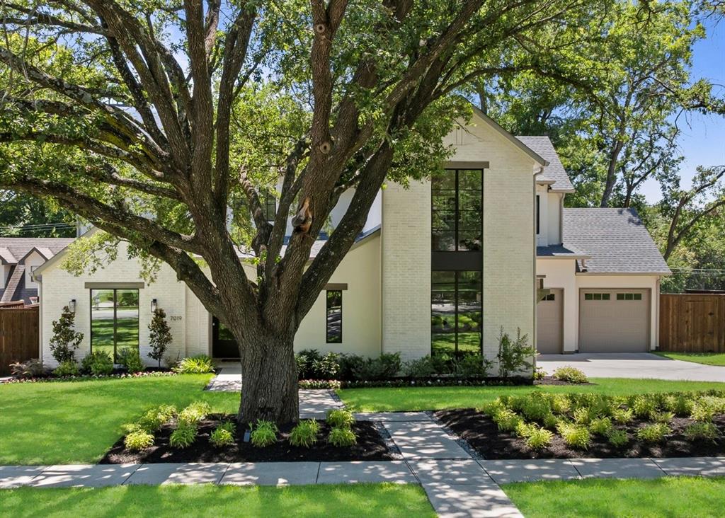 Perfectly situated on a generous 0.37-acre lot near White Rock Lake and zoned to Lakewood Elementary, this custom home blends privacy, elegance, and intentional design. From a rare 4-car garage to a sparkling pool, expansive yard, and refined finishes, this residence is a true standout. Inside, natural light fills the open-concept layout, where designer touches elevate every room. The family room features exposed beams and a striking fireplace, seamlessly flowing into a showstopping kitchen with a waterfall island, white oak accents, custom cabinetry, Viking appliances, and a hidden working pantry. A stylish wet bar with wine storage enhances the home’s entertaining appeal. The first-floor primary suite is a serene retreat with views of the backyard and a spa-like bath featuring a freestanding tub and massive walk-in closet. A spacious study with a full bath and closet offers flexibility  as a currently configured 7th bedroom. Upstairs, enjoy a central game room with four oversized secondary bedrooms—each with an en-suite bath and walk-in closet. One has been transformed into a fully equipped home gym. Expansive sliding doors open to an outdoor paradise: pool, spa, kitchen, fireplace, and ample lawn space designed for gathering and play. Just minutes from White Rock Lake and the Santa Fe Trail, this home offers a rare combination of luxury and lifestyle in the heart of Lakewood.