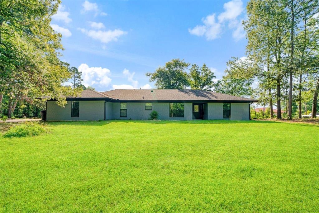 Charming home located in Powderly, Texas!  The home offers over 2078spft of living space, 3bedrooms, 2baths and sits on 1.15 acres of land.  The house has been recently remodeled from top to bottom and includes all new flooring, interior paint, exterior paint, windows, knotty pine ceilings, fixtures and the garage has been converted to a media room or you could make it into an extra living area. The home is also just a few minutes away from Pat Mayse Lake offering plenty of recreational activities from fishing, boating, hiking or camping.  Imagine enjoying your early mornings or late afternoons sitting on the covered back porch listening to the wind blow through the pines or having a place to entertain family and friends!