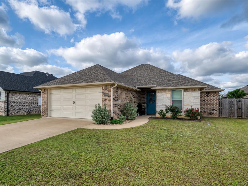 Beautifully maintained 3 bed 2 bath home!  Situated in a desirable Whitehouse neighborhood within Whitehouse ISD, this energy-efficient home offers excellent curb appeal with its brick and limestone exterior. Enjoy relaxing on the covered back porch, complete with stained wood ceilings, recessed lighting, and a ceiling fan. The backyard is designed for entertaining with an extended patio, outdoor gas hookup for grilling, full sprinkler system, gutters, French drains, and privacy fencing. There is a dedicated dog run area, and a conveniently located storage building that will convey. Inside, you’ll find an open and inviting floor plan with 10-foot ceilings in the main living areas, abundant natural light, luxury vinyl plank flooring, and recessed lighting throughout. The spacious living room features an elegant electric fireplace with a wood beam mantel. The kitchen is a standout, offering a large center island, granite countertops, glass tile backsplash, stainless steel appliances, generous cabinetry, and an oversized walk-in pantry. The stainless-steel refrigerator will convey! The private primary suite includes tray ceilings, a spacious walk-in closet, and a well-appointed bath with dual vanities, granite countertops, and a tiled walk-in shower with bench seating. Secondary bedrooms are generously sized, and the guest bath features a deep tub shower combination with tile extending to the ceiling. Additional highlights include a Wi-Fi-enabled oversized two-car garage with keypad entry, tankless gas water heater, electric AC with gas heat, ceiling fans throughout, a mudroom bench for added storage, a separate laundry room with washer and dryer combo that conveys! Forestdale park is currently under construction and should be finished in the Fall! This home and neighborhood offers a perfect blend of comfort, style, and functionality.