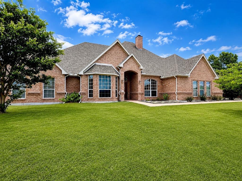 Welcome to your new home situated conveniently in Willow Park with easy access to the highway, shopping, and schools in Aledo ISD. 
The interior of the home features an open concept floor plan filled with natural light. The living room features a fireplace and windows that showcase the picturesque backyard and in-ground storm shelter. The spacious lot provides for privacy as it backs to a green space and is fully fenced to ensure your kids and animals stay safe. Although there isn't a pool in the backyard, there is plenty of space to build one. The kitchen provides ample counter space and cabinet storage. Also in the kitchen, there is a double oven, a Kitchen Aid dishwasher and an updated built in microwave.  
The master suite is huge and includes a massive walk in closet and gorgeous countertops in the bathroom. The master suite is separate from the other bedrooms with two bedrooms near the laundry room on the other side of the house and the other at the front of the house, which can also be considered a flex room or office. There is a formal dining, however it has been used as a sun room, office and alternate living space. 
The HVAC's have been replaced in the last few years as well as a water heater. There is LVP flooring throughout most of the house and tile in the bathrooms. Additional features include an oversized garage and a privacy gate in the driveway. This one has it all!