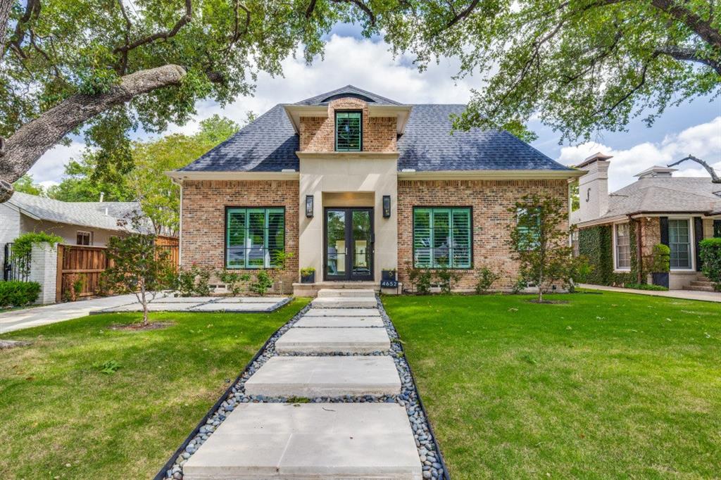 Built in 2023 by McKinley Built Homes, this elegant West Highland Park residence offers 3,253 square feet of refined living space with access to Highland Park police, fire, and town services. The home welcomes you with a dramatic glass entry accented by gas lanterns, leading into a traditional center hall layout with formal dining and a dedicated study.  Designed for both everyday living and entertaining, the kitchen is equipped with premium stainless steel appliances, double ovens, and an expansive marble island.  The adjoining butler’s pantry enhances functionality with a coffee station, wine fridge, microwave, and generous storage.  The main living area features a statement fireplace and expansive windows that fill the space with natural light while overlooking the covered patio and backyard. The primary suite on the first floor offers a private escape with a luxurious bath, including a soaking tub, oversized shower, heated towel feature, and a custom walk-in closet. A nearby laundry room adds convenience. The second level provides two large ensuite bedrooms, a flexible living area suited for media or recreation, and an additional room perfect for a workout space or office. Additional amenities include extensive hardwood flooring, a backup generator, and a two-car garage with epoxy-finished floors, alley access, and an electric gate. The garage also includes two climate-controlled bonus spaces, plus a covered passage connecting it to the main home.