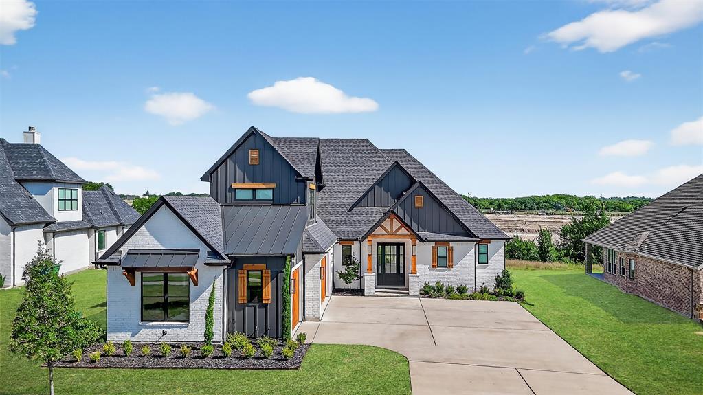 Experience modern luxury at 2028 Fox Bend Trace, a new custom home in Gunter’s prestigious The Bridges at Preston Crossings community. This thoughtfully designed residence offers 3 bedrooms downstairs plus an upstairs bonus room that can easily be converted into a 4th bedroom by simply adding a door. Located above the 3-car garage, the bonus room already includes a half bath and custom closet—making the conversion straightforward and functional.
Inside, you’ll find 2 full and 2 half baths, white oak engineered hardwood floors, striking black-and-white designer accents, and Pella Windows & Doors windows framing peaceful views. The chef’s kitchen impresses with a 9×4 quartz waterfall island, pot filler, and custom cabinetry, opening to a vaulted living area that flows seamlessly onto a cedar-trimmed patio—perfect for entertaining.
The private primary suite features a spa-inspired bath with soaking tub, glass shower, and Hollywood-style layout. Two additional bedrooms share a Jack-and-Jill bath, while the upstairs space provides flexibility as a game room, guest suite, or future fourth bedroom.
Additional highlights include a dedicated home office, spacious laundry room with barn doors, brick pavers, central vacuum system with attachments and baseboard kickplate, oversized 3-car garage, extra-wide driveway, and custom front doors that elevate curb appeal.
Community membership provides access to golf, tennis, clubhouse amenities, and more. Luxury, comfort, and smart design come together beautifully in this exceptional home.
Call your favorite REALTOR® today and come explore everything this stunning home and community have to offer!