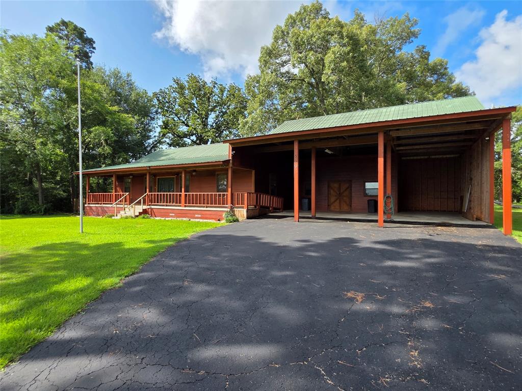 Great water-view home includes two lots, the home and all improvements are located on one lot, the second lot is wooded with trails and a sitting area, the lots have not been combined at the County. Oversized 1,116 sq-ft attached carport with RV space(s) and RV hookups, and an 11' x 33' shop across part of he back wall, it has double doors on buth sides for air flow.  Glass-front wood stove in the LR near the primary bedroom for a backup heat source. The home was built for a geneleman who was confined to a wheelchair, so the home has wide doorways and hallways for accomidation. The neighborhood offers a boat ramp, fishing piers, community playground, pool with pavillions, and a community center (which may be reserved for special gatherings).
INFORMATION DEEMED RELIABLE BUT NOT GUARANTEED.