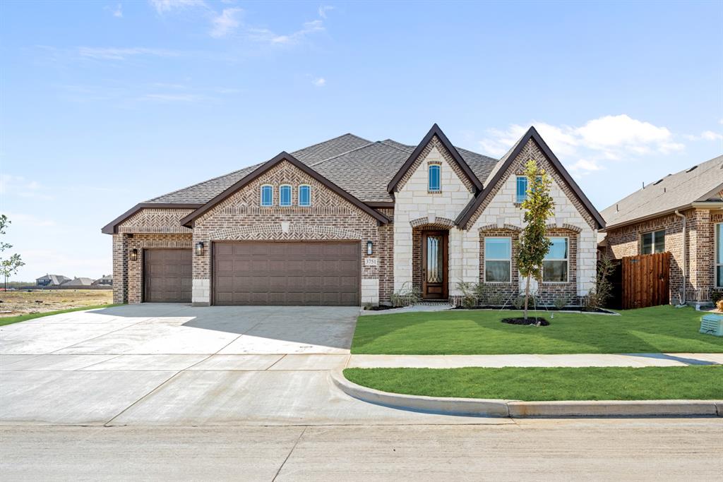 NEVER LIVED IN NEW HOME! Move-In Ready! Welcome to Bloomfield’s Primrose FE, a stunning single-story home that brings together timeless architecture and modern comfort. The brick-and-stone exterior with a large covered front porch, arched windows, and an 8’ wood-and-glass entry door creates an inviting first impression that carries through the entire home. Step inside the rotunda-style foyer and you’re immediately greeted by elevated ceilings and upgraded wood-look tile flooring that continues through the main living spaces, setting a warm yet sophisticated tone. To one side sits a private study, perfect for work or quiet reading, while the open flow beyond draws you into the main living area. The spacious family room centers around a floor-to-ceiling stone fireplace, seamlessly connecting to the Deluxe Kitchen—an entertainer’s dream featuring L5 Vinci quartz countertops, painted cabinetry with drawers and built-in stainless steel appliances, and a large island that doubles as a gathering spot. The dining area and breakfast nook are perfectly placed near the covered patio with an extended concrete pad, ideal for outdoor dining or morning coffee. The primary suite, tucked privately at the back of the home, offers a serene retreat complete with upgraded tile in the ensuite bath, dual vanities, a soaking tub, separate shower, and a large walk-in closet. Two secondary bedrooms share a full bath, while a convenient half bath near the entry is perfect for guests. Finishing touches like upgraded carpet in the bedrooms, full gutters, and a 3-car garage add both style and function. Thoughtfully designed and beautifully finished, the Primrose FE offers all the space and sophistication of a luxury model—visit or call Bloomfield Homes at Kings Fort today to experience this plan in person!