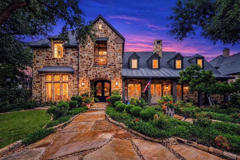 A Former Parade of Homes with beautiful frontage lake views. A luxury property owned by a professional designer in the sought after gated community, The Lakes on Legacy. A Modern Farmhouse exterior with an expansive front porch, lake views and landscaped yard. Grand entry with open concept. The great room features an impressive wall of stone, gas fireplace, two sets of double French doors with views of the lake, vaulted ceiling with 100 year old reclaimed pine beams and hand scraped oakwood floors. A true chef kitchen includes butlers pantry, professional grade appliances, 5 burner gas cooktop, porcelain counters, cabinets that go to ceiling with glass and lighting at top. Family room features 12-ft ceilings, Venetian plaster walls, cast stone fireplace, oakwood floors and a separate wet bar with a hammered copper sink. The study features wood paneling, glass-front cabinetry, designer carpet to look like axis deer hide and double French doors with more lake views. The primary bedroom features bay windows with views of the landscaped backyard and pool. The primary bathroom has travertine slab counters, jetted tub, frameless shower, dual sinks and vanishing vanity mirror TV. The upstairs has a full media room with all equipment to stay with home. A Game room with built in cabinets and backyard pool views. Three large bedrooms with their own en suites. One bedroom has outdoor balcony with more lake views. The upstairs also has a work or homework area with two work stations and a sky light. The backyard features a very large covered patio with sky lights and beams. From the patio a meticulously designed walkway leads to the pool and more seating areas. Built by custom home builder Belmont Jay Young this home is a one of a kind in this area and a must see to appreciate all it's beauty and finish out.