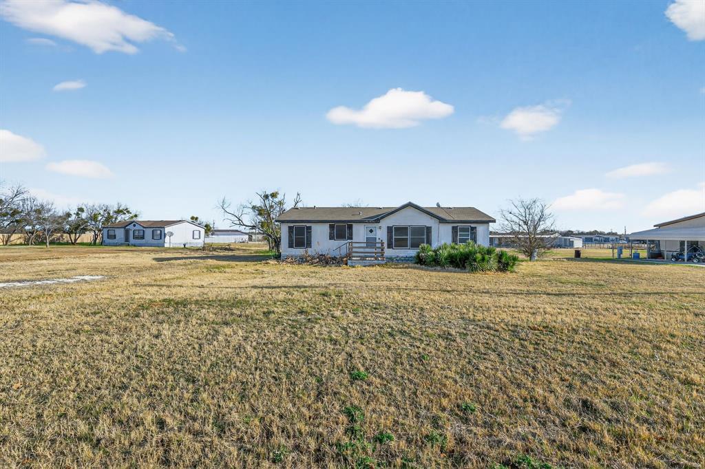 MOVE IN READY & NEAR TOWN is this spacious 3 bedroom 2 bath manufactured home in Wildhorse Subdivision features a wonderful kitchen with abundant cabinets & counter tops. Over-sized living room with open concept, split bedrooms, huge master bathroom with His & Her sinks, garden tub & separate shower. Freshly renovated to include new floors this home will not last long! All this on .632ac with scattered trees, perfect amount of space!