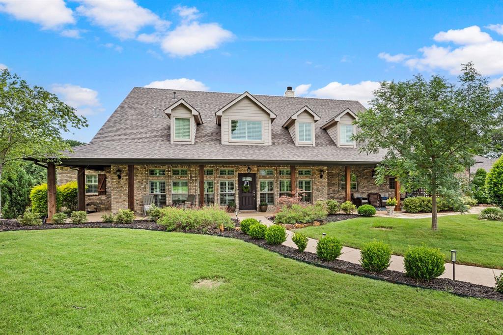 Tucked away on just over TWO beautifully landscaped acres, this modern farmhouse dream home offers the rare combination of complete privacy and everyday convenience. Located in the heart of Flower Mound with no HOA, this exceptional property feels like a private retreat while remaining just minutes from shopping, dining, and entertainment.The thoughtfully designed floorplan spans over 5,000 square feet with 4 bedrooms, 4.1 baths, and 3 spacious living areas. Warm, on-trend paint colors, abundant natural light, and inviting living spaces create a home that feels both elevated and welcoming. The expansive kitchen is truly the heart of the home, featuring a massive island, extensive cabinetry, and seamless flow into the main living and dining spaces—perfect for entertaining and everyday living. The first floor offers two bedrooms, a welcoming guest room with ensuite, also including a luxurious primary suite. While upstairs features two additional ensuite bedrooms and a large third living area ideal for a game room, media space, or private retreat. Step outside to your own backyard paradise complete with a sparkling pool and spa, outdoor kitchen area, wrought iron fencing, and dream-worthy landscaping that surrounds the property with natural beauty. An oversized 3-car garage that provides plenty of room for vehicles, storage, or hobbies. A rare opportunity to enjoy peaceful, luxury living with space to breathe—without sacrificing proximity to everything Flower Mound has to offer. Quick 20-30 minute commute to DFW Airport!! Will CONVEY with sale 2 refrigerators & freezer, washer & dryer, shelving upstairs game room, patio umbrella.** Ask your agent to send you the Virtual Tour package and info at the Transaction Desk!**