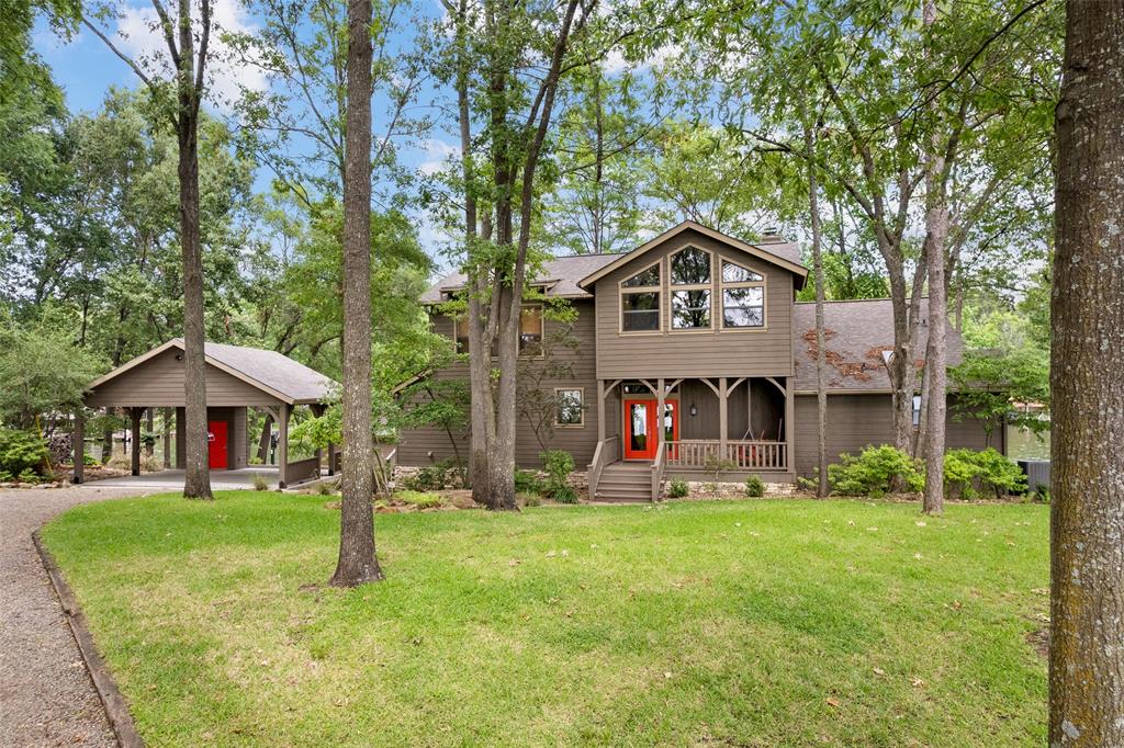 Gorgeous two-story lake home with both cove views and huge main lake views. Situated near the cul-de-sac end of the #1residential street on Lake Cypress Springs (based on average home value), this custom-built home features three spacious bedrooms, all with ensuite bathrooms. Situated in an open concept, the kitchen features quartz countertops, stainless appliances and lots of cabinet and drawer space. Just around the corner is the powder room and utility room. The dining area features huge windows and a really neat, adjacent screened porch. A clearstory vaulted living room features its own huge windows (lots of natural light) and a cozy wood-burning fireplace. The master suite has a vaulted ceiling and a screened porch. Its bathroom has recently been renovated with new tile, countertops and fixtures. Upstairs is a spacious loft(great working space) that leads into two ensuite guest rooms. Outside the property includes a large tree-shaded deck, wonderful 2-car carport, whole-house emergency generator and a 2-stall, deep-water boathouse that sits in front of over 178' of platted shoreline in the wide, safe cove. This property truly has it all including quality and location.