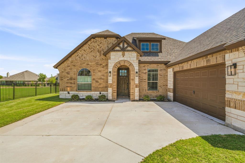 Welcome to this incredible like new home in Abes Landing, where style and comfort come together beautifully. Inside, you'll find durable wood-look tile flooring throughout, elegant granite countertops, and thoughtfully designed living spaces.
The spacious primary suite is a true retreat, featuring a large soaking tub, separate walk-in shower, and a dual-sink vanity.
The kitchen is sure to impress with its gorgeous stained cabinetry, gas cooktop, granite countertops, and an expansive center island that overlooks the living room—perfect for entertaining or everyday living.
Step outside to enjoy the covered back patio, an ideal space for morning coffee, quiet evenings, or gathering with family and friends. This backyard offers the perfect setting to relax and enjoy the outdoors.
