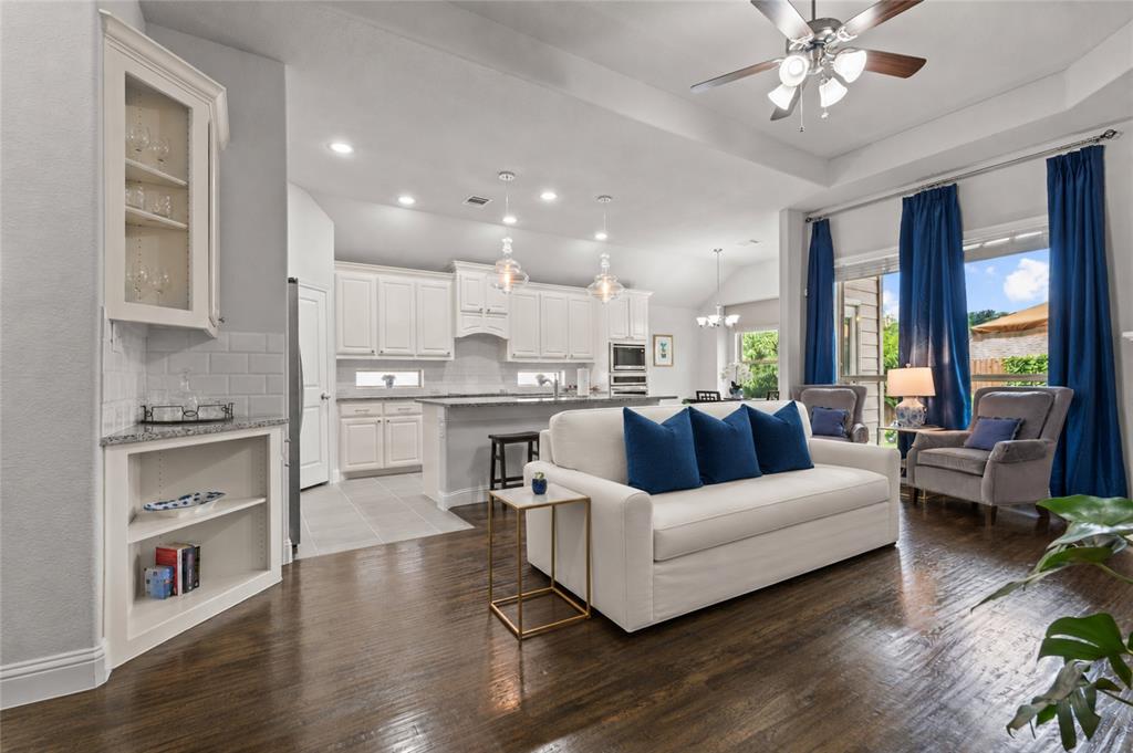 The best homes are the ones that make you slow down the moment you walk inside. Sunlight pours through the windows, the spaces feel open and welcoming, and you can immediately picture yourself living there. That's exactly what you'll find at 9621 Rosina Trail.

Tucked into a quiet section of Skyline Ranch, this beautifully maintained 4 bedroom, 3 bathroom home offers the space, comfort, and flexibility today's buyers are looking for. Rich wood floors, brand new carpet, soaring ceilings, and abundant natural light create a warm, inviting atmosphere throughout.

The kitchen is the heart of the home with white cabinetry, granite countertops, a large island, upgraded lighting, and unique windows built into the backsplash that fill the space with sunlight. The dining room is surrounded by windows and is perfect for everything from family dinners to holiday gatherings.

The downstairs primary suite offers a peaceful retreat, while two additional first floor bedrooms provide flexibility for family, guests, or a home office. Upstairs features a spacious second living area, a fourth bedroom, and a full bath that make an ideal media room, guest suite, or private workspace.

Thoughtful upgrades include custom drapes, designer lighting, a statement fandelier, a hall tree by the garage entry, and a full size utility room with a sink and extra storage.

Outside, you'll enjoy a covered patio, lush lawn, colorful landscaping, and a backyard designed for relaxing or entertaining.

Located across from a stocked fishing pond and just minutes from walking trails, Walnut Creek Park, and highly regarded Westpark Elementary, this home offers a lifestyle that's just as appealing as the home itself.

Move in ready and thoughtfully updated, 9621 Rosina Trail is ready to welcome its next owners. Come see why this home stands out from the rest.