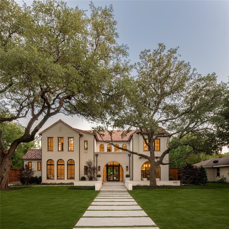 New construction scheduled for completion June 2026. The home features a 22-foot atrium-style entry leading into a 14-foot great room, anchored by an 80-inch linear Isokern fireplace. An 18-foot multi-panel sliding door opens directly to a screened-in patio, creating a strong indoor-outdoor connection. Interior finishes include 7-inch plank flooring, designer lighting, Lincoln wood windows, and Emtek and Top Knobs hardware. Marble and quartzite countertops are carried throughout the home. The kitchen is equipped with Wolf and Sub-Zero appliances and supported by a walk-in pantry, butler’s pantry, and adjacent breakfast nook. Additional functional spaces include a dedicated study, formal dining room, media room, game room, exercise room, and both upstairs and downstairs laundry rooms. The primary suite includes white oak ceiling beams, vaulted ceilings, separate his-and-hers closets, and a built-in coffee bar. Secondary bedrooms also feature vaulted ceilings. Entertaining elements include a full wet bar and temperature-controlled wine room. Outdoor features include a screened-in patio with fireplace, heaters, built-in grill, and sink. The backyard is finished with turf and includes a pool, spa, and built-in fire pit.