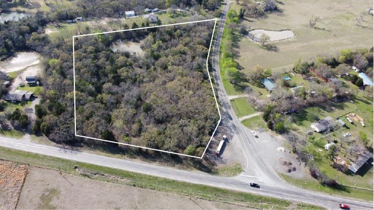 This land supports multiple uses, including residential, recreational, or investment purposes.

Unrestricted Land Use: No zoning regulations according to the county, with a grandfathered wildlife exemption.

Wooded Terrain: Completely wooded parcel with mature trees throughout.

Road Frontage: Approximately 1,215 feet with a corner lot configuration.

Water Features: Includes a 0.83-acre pond and approximately 102 linear feet of creek.

Elevation: Approximately 15 feet of total elevation change across the property.

Fencing: Partial woven wire fence.

Access Improvements: Unlocked gated entrance with interior road clearing.

No Utility Easements: No utility easements affect the property.

Outside City Limits: Located outside city limits, offering added flexibility.

Why Canton?

Proximity to Major City: Dallas, Texas, is approximately 1 hr 4 min (60.5 miles) away.
Nearest Small Town: Canton, TX is 7 min (4.6 miles) away.

Don’t miss this opportunity! Contact us today for showing instructions.
