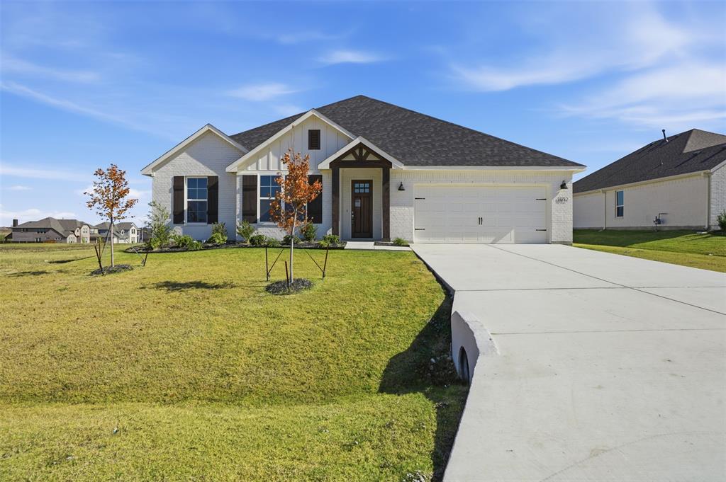 *Preferred Lender pay Title Policy; Builder Incentives-$5k towards closing costs, $5k towards fence, blinds, fridge or W-D pkg*
Looking for a home that feels thoughtfully designed and easy to live in? This newly built home in Wildcat Ridge, a gated community in Godley, offers a comfortable blend of modern finishes and everyday functionality. With convenient access to the Chisholm Trail Pkwy, commuting to Downtown FTW is simple for workdays and weekends. Inside, warm luxury vinyl wood-style flooring flows through the main living areas, creating a welcoming feel from the entry. A distinctive brick archway leads into an open-concept layout where the kitchen, dining, and living spaces connect naturally, making the home feel open yet well defined. The kitchen is designed for both style and function, featuring a large eat-in island, granite countertops, stainless steel appliances, gas cooktop, designer lighting, and a classic tile backsplash. The adjoining living area offers a comfortable central space for daily routines or casual gatherings. At the front of the home, a flexible room can easily serve as a office, study, or formal dining area. Upstairs, an additional living area with a half bath provides flexibility for a media room, game room, or secondary lounge. The primary suite is set apart for privacy and includes a spa-inspired bathroom with a soaking tub, separate shower, dual sinks, and spacious walk-in closet. Three additional bedrooms on the main level, offer a practical and adaptable layout. Outside, the oversized cul-de-sac lot features full landscaping with irrigation, creating a polished outdoor setting from the start. Located within Godley ISD and surrounded by rolling Texas hills, while remaining close to Benbrook Lake, The Shops at Clearfork, and the new Godley High School. Wildcat Ridge offers shared amenities including an amenity center, walking trails, a playground, and 2 pools. Move-in ready, this home offers a modern approach to comfortable living.