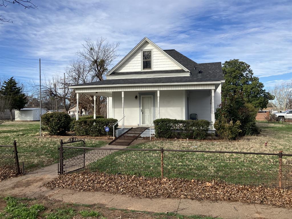 Beautiful 121-year-old home in great condition on huge, over-sized lot with mature pecan trees and a new metal 24 by 24 carport. Home features a wrap-around wooden porch, original doors, new windows, updated flooring, brand new flooring in the kitchen (just installed), 1 yr old asphalt shingle roof and a stunning wooden staircase. A detached garage with electricity sits behind the house as well as a 16 by 16 metal storage shed. This home has been very well maintained and does not reflect its age. All appliances stay with the house. A new survey and a professional cleaning were just completed.
