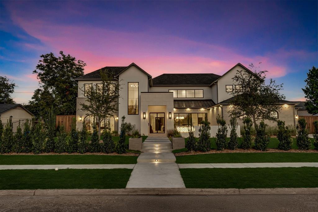 An architectural showpiece by Bressler Design + Build, this modern masterpiece perfectly balances luxury design, natural light, and inviting warmth. Spanning 6,100 sq. ft., the residence offers five ensuite bedrooms, six baths, and a three-car garage in one of Dallas’s most coveted neighborhoods.
Step inside to soaring ceilings and an open layout framed by expansive glass walls that blur the line between indoors and out. The chef’s kitchen impresses with Taj Mahal quartzite countertops, custom cabinetry, and a Wolf,Sub-Zero,Cove appliance suite, anchored by a temperature-controlled wine room enclosed with arched glass doors. In the living room, retractable glass panels open fully to a covered patio with built-in heaters and motorized mosquito screens providing a seamless setting for year-round entertaining.
The primary suite is a serene retreat featuring a private courtyard and a spa-inspired bath wrapped in natural stone, with accent lighting, a freestanding soaking tub, and a glass-enclosed shower. Every bedroom is equipped with powered shade pockets for effortless light control and privacy. Throughout the home, designer fixtures, white oak floors, and architectural arches create a timeless sense of sophistication.
Built for performance as much as beauty, 3 car garage, this home features a Class 3 impact-resistant Atlas Pinnacle Pristine roof, Carrier Infinity 19-SEER variable-speed HVAC, full spray-foam encapsulation, and smart-home readiness for effortless comfort and efficiency. Every detail from the refined finishes to the curated lighting reflects a commitment to craftsmanship and modern luxury living in Dallas.