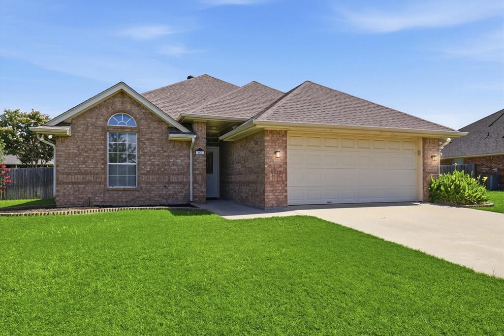 Welcome to 206 Mourning Dove in the heart of Krum, where comfort, functionality, and charm come together. This well-maintained 3 bedroom, 2 bath, move-in ready home features an inviting open layout with a cozy fireplace that creates a warm focal point for the living area. A neutral color palette throughout provides the perfect backdrop for any style of décor. The spacious primary suite is a true retreat, featuring dual closets and an ensuite bath with dual sinks, a relaxing soaking tub, and generous under-sink storage. Step outside to enjoy the fully fenced backyard with a covered patio, ideal for relaxing evenings, weekend BBQs, or entertaining family and friends. The garage is outfitted with built-in cabinets, providing excellent storage and workspace for tools, hobbies, or organization. Conveniently located near Krum schools, parks, and everyday amenities with easy access to Denton, this home offers the perfect blend of small-town charm and modern convenience. Don't miss your opportunity to make this one your own!