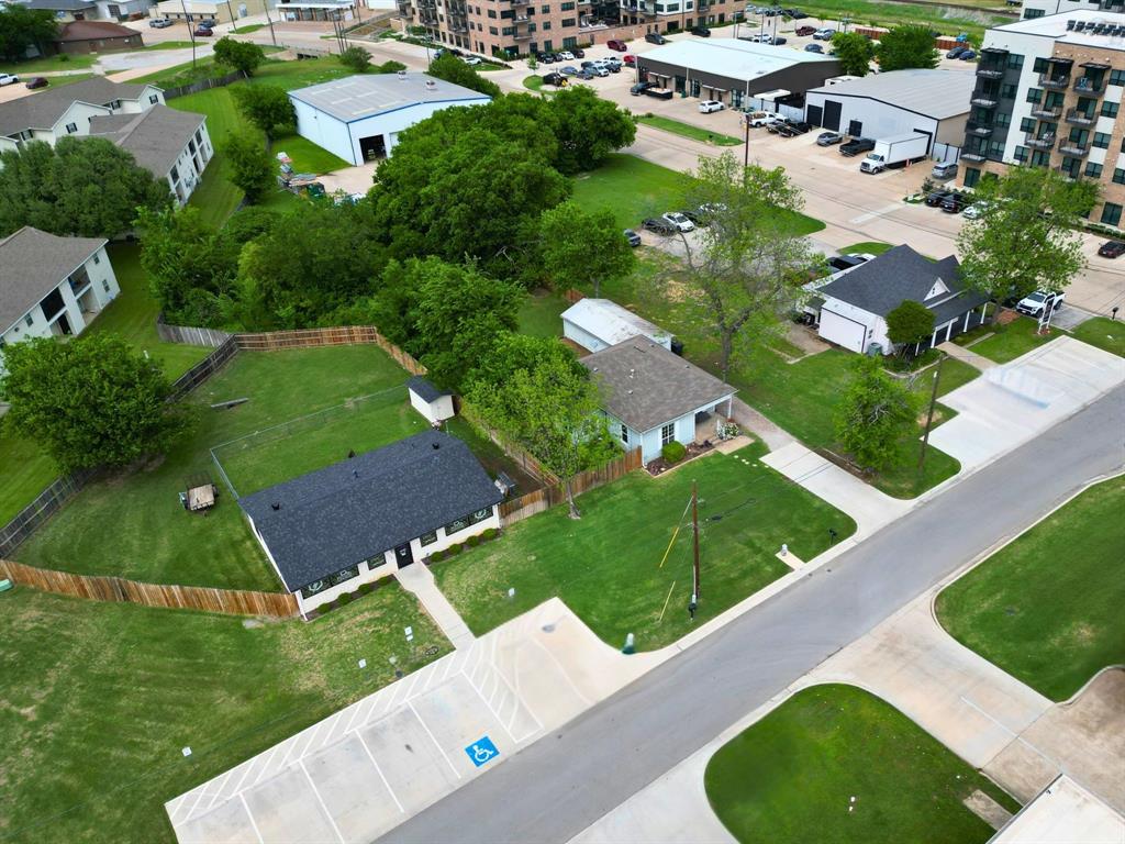 132 W King St sits in the heart of Old Town Burleson, exactly where you want to be if location matters. This property opens the door to a wide range of possibilities, whether you're looking to add to your investment portfolio, expanding, or start your business in a high-visibility area. With potential for residential use or future commercial rezoning, this property has the flexibility you're looking for.
The home offers two bedrooms and one bathroom, with a functional layout that starts with a welcoming living area right as you walk in. The primary bedroom is conveniently positioned off the main living space. Toward the back of the home, the kitchen features an electric range, farmhouse sink, dishwasher, and modern cabinetry and countertops.
The second bedroom sits just off the kitchen, offering decent closet space and direct access to the garage. Nearby, an oversized laundry room includes washer and dryer hookups plus extra room that could easily be converted into a walk-in pantry or additional storage space.
Out back, you’ll find a generously sized yard with updated privacy fencing that gives you plenty of space for entertaining, expanding, or customizing to fit your vision.
If you’ve been waiting for the right mix of location, flexibility, and potential, this is it.