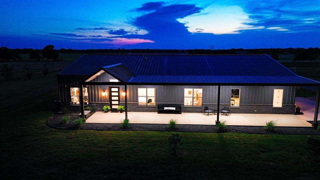 SOME HOMES ARE BUILT TO SELL. THIS ONE WAS BUILT TO KEEP. If you've been waiting on a place that actually checks the boxes, quit scrolling. Set on 10 gorgeous acres in BROCK ISD, this custom-built ranch is the real deal. The striking black exterior, massive porches, vaulted ceilings, and incredible kitchen create the kind of first impression that sticks with you. Behind the beauty is a level of craftsmanship that's hard to find, with steel-reinforced construction, spray foam insulation, underground utilities, and thoughtful planning throughout. The land is ready to work from day one with cross fencing and water distributed across the property, making it ideal for rotational grazing, livestock, horses, or a true family homestead. The impressive shop features an oversized RV bay with full hookups plus a private apartment, creating exceptional flexibility for multi-generational living, guests, extended family, or a home-based business. But let's be honest, you're not buying 10 acres in Parker County because of fencing and infrastructure. You're buying the sunsets. You're buying the dark skies. You're buying that first cup of coffee on the porch while the world is still quiet. You're buying room to roam, room to breathe, and the feeling you get when you turn off the county road and realize you're finally home. Places like this are why people move to Parker County in the first place. Quality. Character. Privacy. Space. A little more freedom and a lot less noise. 10 ACRES. BROCK ISD. WATER WELL. BUILT TO LAST. BUILT TO KEEP !!!