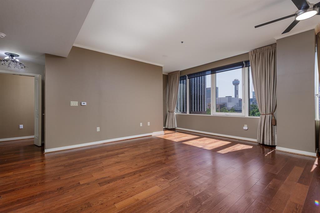 Back on the market due to buyer's plans changed—no fault of the property. This is a great opportunity for a new buyer!
 Experience elevated urban living in this spectacular third-floor corner residence with breathtaking, unobstructed views of the iconic Downtown Dallas skyline. This exceptional unit offers a rare and highly desirable layout featuring a private tandem garage and dedicated storage unit conveniently located on the same floor—just steps down the hallway. An additional secured entry door enhances privacy while providing added noise reduction from the common corridor.

Designed for both comfort and style, the open-concept floor plan seamlessly blends living, dining, and kitchen spaces—perfect for entertaining or enjoying a quiet evening overlooking the city lights. The modern kitchen is outfitted with stainless steel appliances, and the refrigerator, washer, and dryer will convey with the sale for a truly move-in-ready experience.

The spacious primary suite features dual His and Hers closets, offering generous storage and functionality. As a corner unit, natural light pours in from multiple exposures, creating a bright and inviting atmosphere throughout.

Residents enjoy access to resort-style amenities, including a stunning rooftop pool with grilling area, state-of-the-art fitness center, private movie theater, conference room, and an elegant clubhouse complete with a full kitchen—ideal for hosting gatherings. A 24-hour concierge provides convenience, security, and peace of mind.

Located in the heart of the action, this residence is just moments from the American Airlines Center, Klyde Warren Park, Victory Park shopping and dining, the Dallas Area Rapid Transit, and some of the city’s finest restaurants and entertainment venues.

This is luxury high-rise living at its finest—where convenience, privacy, and panoramic city views come together in one extraordinary opportunity.