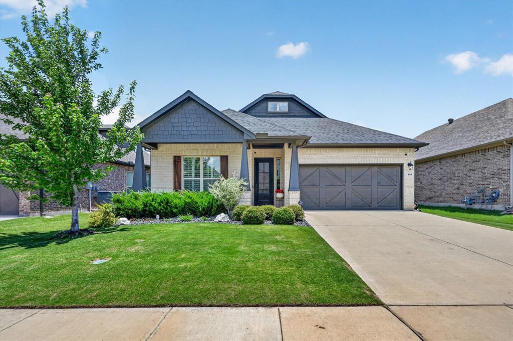 Welcome home to this charming one-story Southeast Arlington residence featuring three generous bedrooms, two baths, and a two-car garage. Bathed in natural light, the home showcases beautiful engineered wood floors, gleaming quartz countertops, upgraded lighting throughout, and a dedicated study with elegant glass French doors. The modern interior blends seamlessly with classic Craftsman flair, creating a warm and inviting space. Step outside to enjoy a large covered patio with gas stub-out, and expansive fenced yard, perfect for relaxing or entertaining.