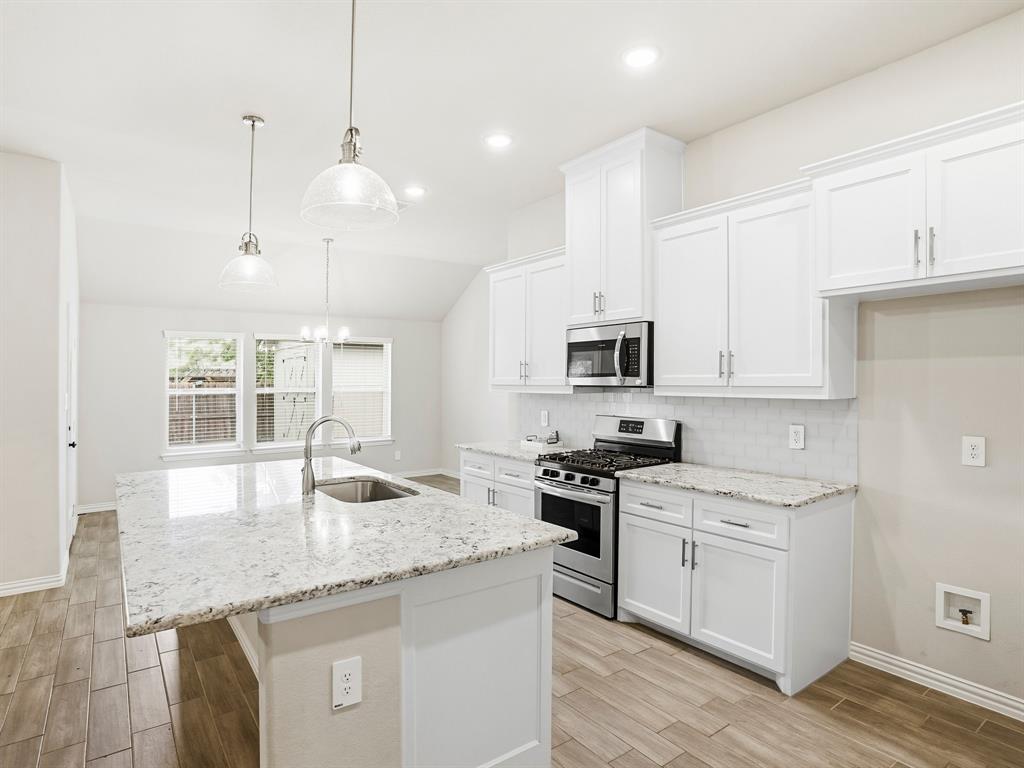 Welcome to this stunning modern style home in the desirable Willow Vista Estates Community. This beautiful 4-Bedroom, 2-Bath features an open concept layout perfect for modern living. Enjoy a spacious living area with a cozy fireplace, a stylish Island kitchen and a large dining area. Home offers a perfect blend of comfort and functionality with its thoughtful design and high-quality finishes. Large newly built shed in the yard and added attic decking for storage. Enjoy the community offers easy access to community pool, walking trails, sports court, parks and dog parks.