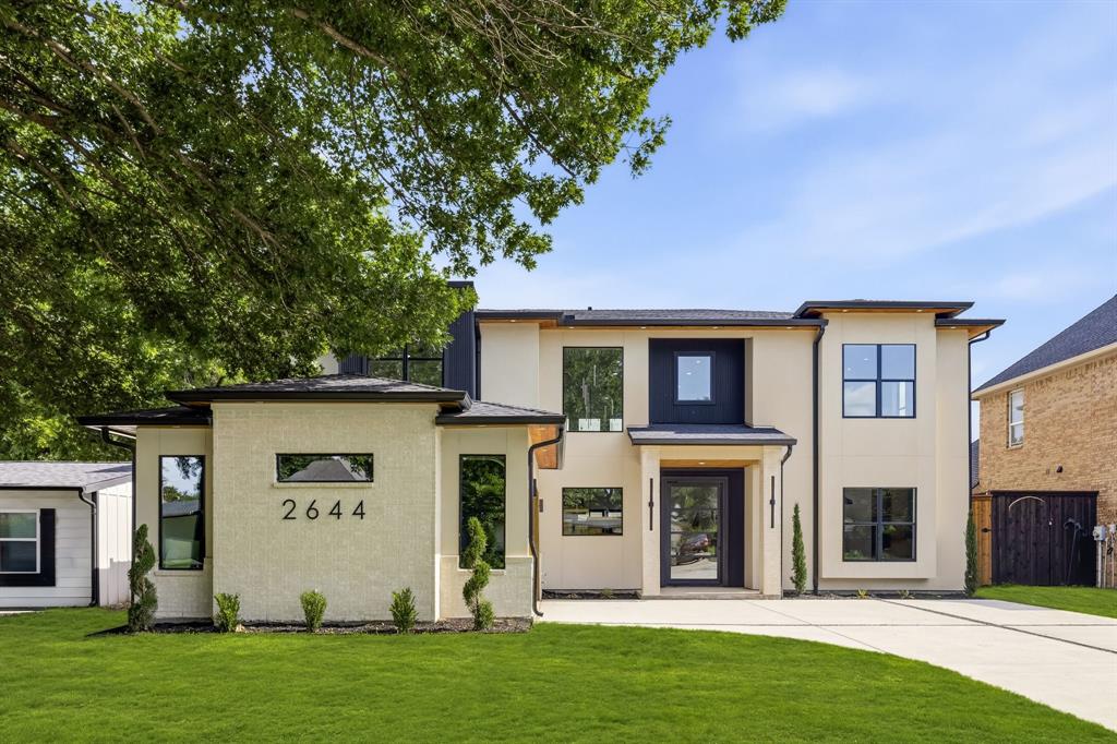 Modern Luxury Meets Thoughtful Design in This One-of-a-Kind Custom-Spec Home. Experience elevated living in this stunning 3,680 sq ft modern residence, thoughtfully designed with clean lines, warm natural materials, and high-end custom finishes throughout. Featuring 4 bedrooms, 3.5 bathrooms, and a highly functional layout, this home seamlessly blends luxury with everyday livability. Step inside to a breathtaking living space with soaring 22-foot ceilings and a dramatic floor-to-ceiling accent wall, perfectly paired with a striking floating staircase featuring white oak treads and sleek glass railings. Natural light pours in through expansive glass, highlighting the home’s architectural details and open-concept design. The chef’s kitchen is a true showpiece, boasting white oak cabinetry, Taj Mahal quartz countertops, and an oversized 10-foot island ideal for entertaining. A designer vent hood and integrated lighting complete the space, creating both function and visual impact. The private primary suite offers a true retreat with his-and-hers walk-in closets and a spa-inspired bathroom featuring a 10-foot walk-in shower with dual shower heads and a freestanding soaking tub. Enjoy seamless indoor-outdoor living with a 400 sq ft covered patio and a 16-foot sliding glass door, perfect for entertaining or relaxing year-round. With custom detailing, and carefully curated finishes, this home delivers a rare combination of modern architecture and warm, livable design.