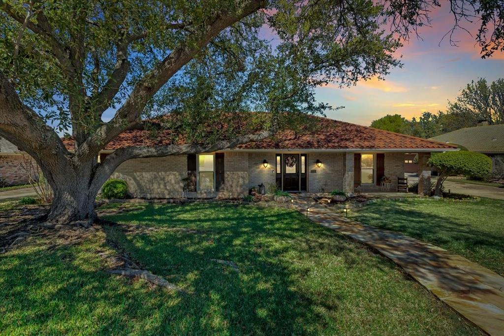 Welcome to 1111 Berkshire Court, a beautifully updated single story home featuring 4 bedrooms, 2.5 bathrooms, office, formal dining, a designated bar area and an oversized 2 car garage all situated on a spacious 0.25-acre lot in the highly sought-after, non HOA area  of Trophy Club.
This bright, open-concept floor plan offers split bedrooms and an abundance of natural light throughout. The primary bedroom features its own entrance to the backyard offering convenient access for entertaining or unwinding on the covered patio during peaceful evenings.
The chef’s kitchen provides generous counter and cabinet space, complemented by a light, neutral color palette and thoughtful upgrades such as granite counter tops, pull-out drawers for enhanced functionality. The breakfast area flows seamlessly into the kitchen, creating a warm, light filled setting with sliding doors that lead to the backyard oasis an ideal layout for gathering, dining, and hosting. The family room and patio are equipped with built-in surround sound, enhancing both indoor and outdoor living experiences. Step outside to find an extended stamped concrete patio with a pergola and power shade screen, creating a comfortable outdoor space to enjoy year round. This home also features an impressive list of updates, including a new metal tile roof, new windows, sliding doors, LVP flooring, fresh interior paint, and granite countertops. Beautifully curated spaces, and exceptional outdoor amenities, this home offers the perfect blend of comfort, style, and lifestyle. Conveniently Located minutes from 114 close proximity to airport, shopping, dining, entertainment, dog parks, golf course, lake and so much more.