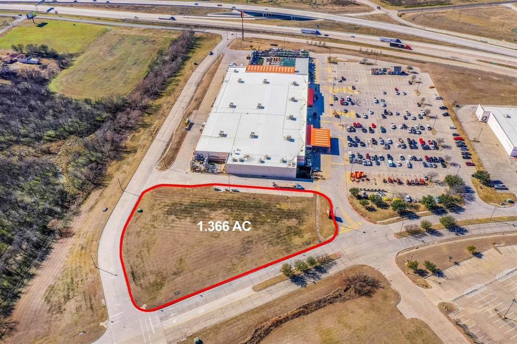 Great Commercial Pad site in the growing Corsicana Area!!  Pad site sits inside the Corsicana Crossings development directly behind Home Depot, and surrounded by multiple other big retailers and restaurants.  Great location just off of IH 45 Frontage Road.  Bring your business, ideas, and investors to Corsicana Crossings!  Easy access to IH 45 and Highway 287.  IH 45 has an average of 42K vehicles per day.  Lot sits just 2 miles north of the brand new Highway 31 Bypass. Only 50 minutes south of Dallas! Utilities are available at street.