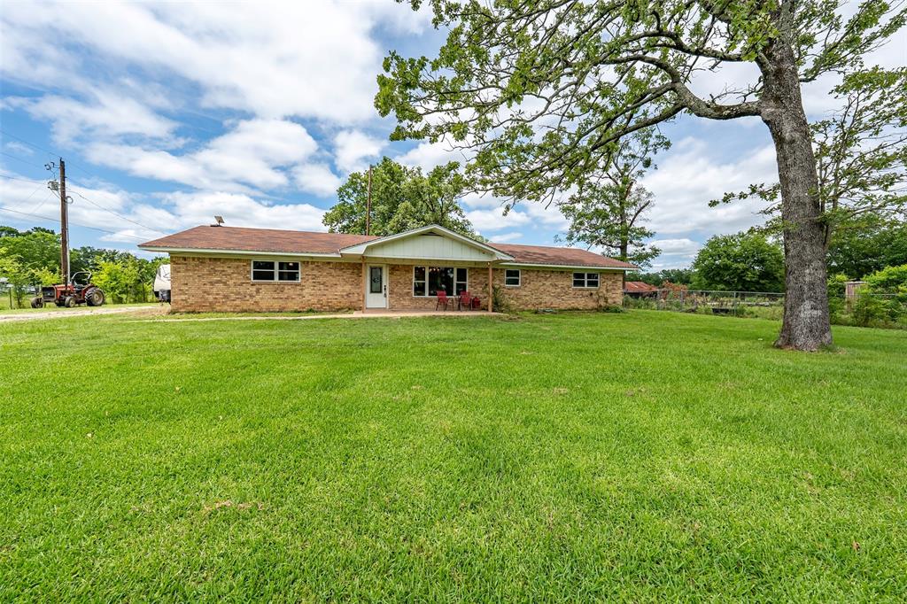 Escape the city life to the tranquility of East Texas with this totally remodeled 3 bed 2 bath home nestled on 31 sprawling acres in Hawkins, TX. This retreat offers the perfect blend of peaceful country living and modern comfort, ideal for homesteading, recreation, or simply enjoying wide open spaces. Step inside to a welcoming floor plan featuring a garage conversion living area, a well appointed kitchen with quartz counters, farmhouse style sink, 3 ovens, ample cabinetry, breakfast bar and large dining area. The primary suite includes a private bath with separate shower and soaking tub, while 2additional bedrooms offer plenty of space for family, guests or home office. Outside you will find open pasture with scattered trees, perfect for grazing livestock, or additional living-workshop. Located just minutes from Lake Hawkins and an easy drive to either Tyler or Longview. Whether you are looking for fulltime living, small ranch, or room for the whole family this property delivers. Come see! Come Buy!