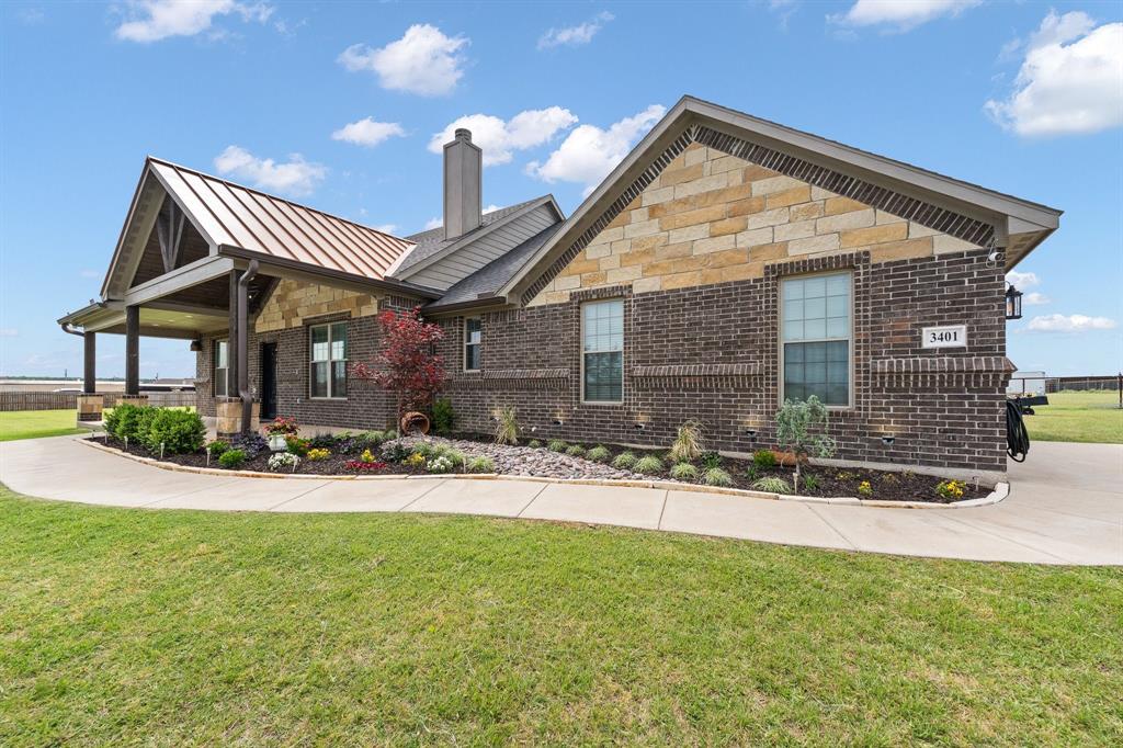 New Roof scheduled June 2026!!! Welcome to your private slice of Texas living! Situated on a fully fenced 1-acre corner lot outside city limits, this property offers the freedom you’ve been looking for—NO HOA, low tax rate, no city taxes and no known restrictions. Bring your horses, chickens, RV, or boat—there’s room for it all with a concrete drive and gated entrance. The land is thoughtfully set up for both relaxation and functionality, featuring vegetable garden beds, a playground, beautiful landscaping, and stunning outdoor lighting. Enjoy peaceful mornings and evenings on the Texas-sized front and back porches, with a wood or gas-burning fireplace for year-round enjoyment. Step inside to an inviting open living space highlighted by a fireplace with gas starter, hearth, and mantel, vaulted wood ceilings, custom built-ins, and abundant natural light. The chef-inspired kitchen is designed to impress with a large island, granite countertops, dual sinks, microwave drawer, 36-inch gas range with pot filler, pendant lighting, soft-close cabinetry, and a spacious walk-in pantry. Function meets convenience with a mudroom off the garage and a Texas-sized utility room featuring a sink, counter space, and room for an additional refrigerator and freezer with water line. The primary suite offers a true retreat with natural light, dual vanities, a soaking tub, and a separate oversized shower with dual shower heads, including a rain shower. The extra-large walk-in closet includes built-ins for optimal organization. Secondary bedrooms are generously sized, each with walk-in closets. Located just minutes from the Chisholm Trail Parkway, enjoy an easy commute to Fort Worth while living the quiet country lifestyle.