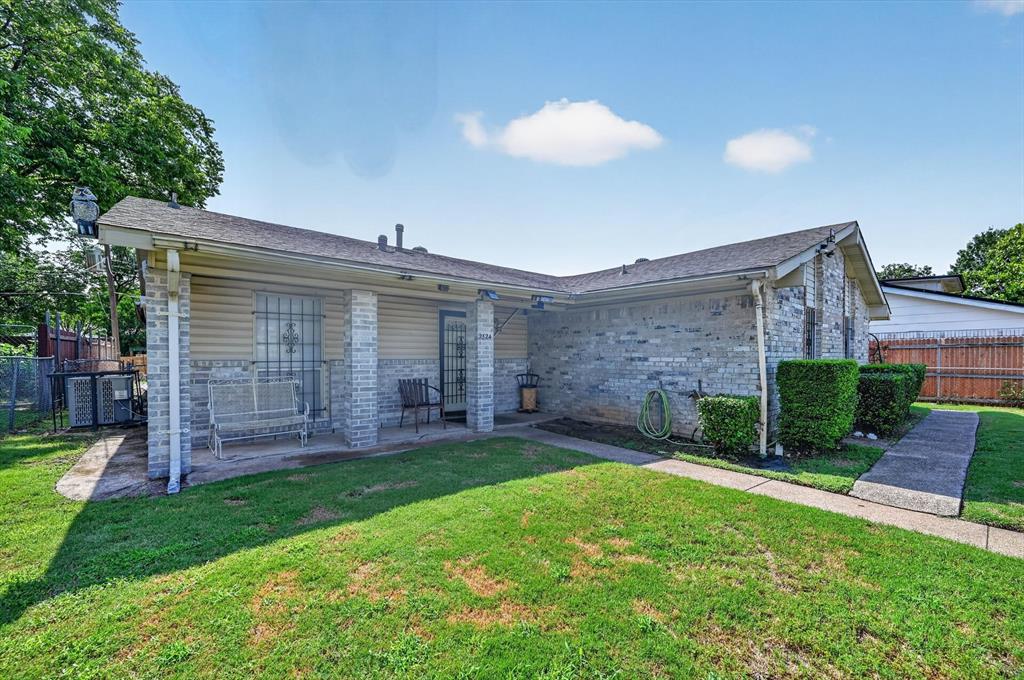 Sold AS IS! This 4-bedroom, 2-bath traditional brick home in Dallas offers a spacious single-story layout with multiple living areas, a den with a brick fireplace, family room, and large flex room. An eat-in galley kitchen features a breakfast bar, built-in cabinetry, gas range, dishwasher, and vented exhaust fan. The primary bedroom includes an ensuite bath and walk-in closet, while the additional bedrooms provide flexibility for guests, office space, or everyday living. Enjoy a generous backyard with covered porch areas, a storage shed, chain-link fencing, alley access, and a rear-facing attached garage with workshop space. Primary bathroom shower remodeled. HVAC replaced in 2025. Roof is approximately 6 years old. Water heater replaced within the last 2 years. Conveniently located in the Bruton Terrace area with access to Dallas ISD schools, this property offers solid potential for buyers looking to update, renovate, or customize to their needs. Property is being sold AS IS; buyer and buyer’s agent to verify all information, including schools, measurements, condition, taxes, utilities, and permitted use.