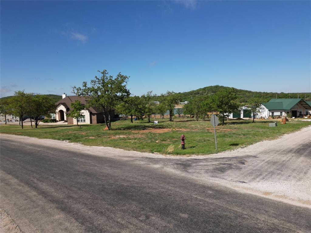 Discover the perfect opportunity to build your dream home on this beautiful lakefront lot, offering breathtaking water views, peaceful surroundings, and direct access to the lake.  Nestled in a quiet and scenic area, this property provides the ideal setting for a full-time residence, vacation getaway, or investment property.  This spacious lot features gently sloping terrain that leads down to the shoreline, making it perfect for building a custom home with panoramic lake views.  Mature trees provide privacy and shade while still allowing plenty of open space for construction.  Imagine waking up each morning to sparkling water views and enjoying sunsets over the lake from your future porch or deck.  The property offers easy access to boating, fishing, kayaking, and other water activities right from your backyard.