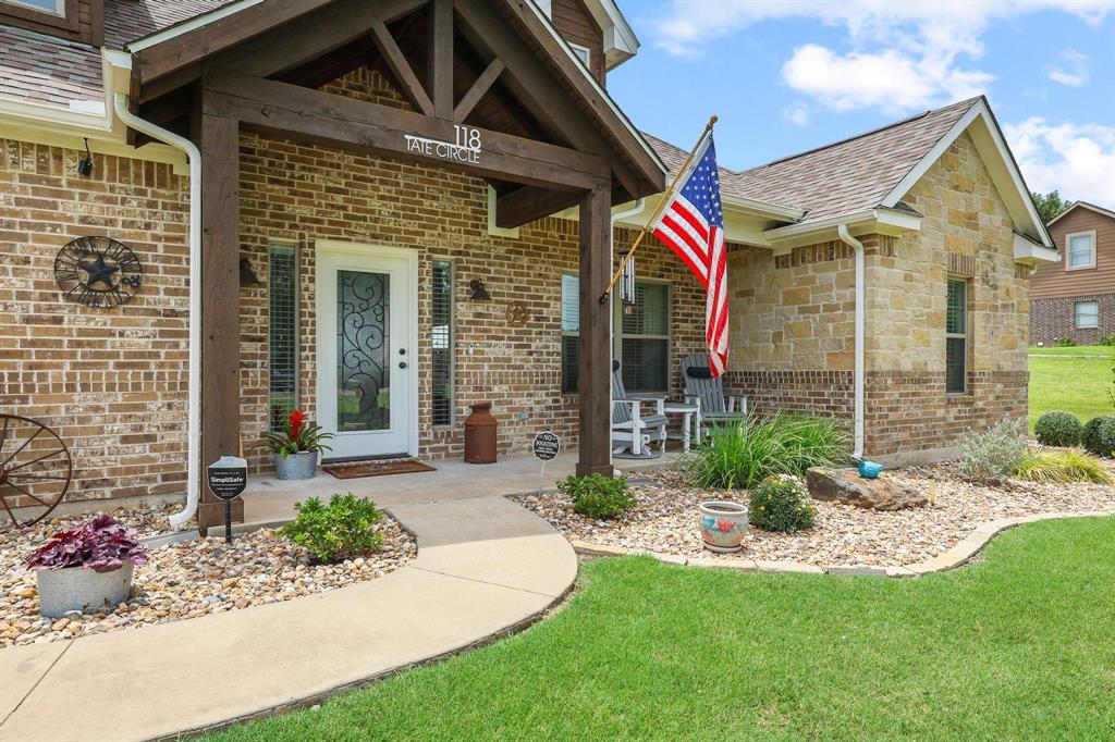 Warm, welcoming, and thoughtfully upgraded, this 5 bedroom, 4 bath home offers 2,701 square feet across two stories with inviting indoor spaces and standout exterior features. The open kitchen, living, and dining layout creates a clear flow for everyday living, with bright gathering spaces that feel comfortable from the moment you step inside.

The property includes a 2 car attached garage, a 2 car carport, and a 30x40 workshop with roll up doors, offering excellent flexibility for storage, hobbies, projects, or equipment. The workshop also includes a lean-to that runs the length of the building, adding even more covered utility space.

Out back, the large extended stamped concrete patio is designed for lasting enjoyment. An extended roof provides covered outdoor living space, while the outdoor kitchen creates a natural place to gather during quiet mornings, golden hour evenings, or weekends at home. A custom backyard fence adds privacy and helps create a tucked-away patio setting with a sense of comfort and belonging.

Located in Howe ISD, this home offers practical space, thoughtful upgrades, and special touches throughout, all brought together in a property that feels well cared for and ready for its next season.
