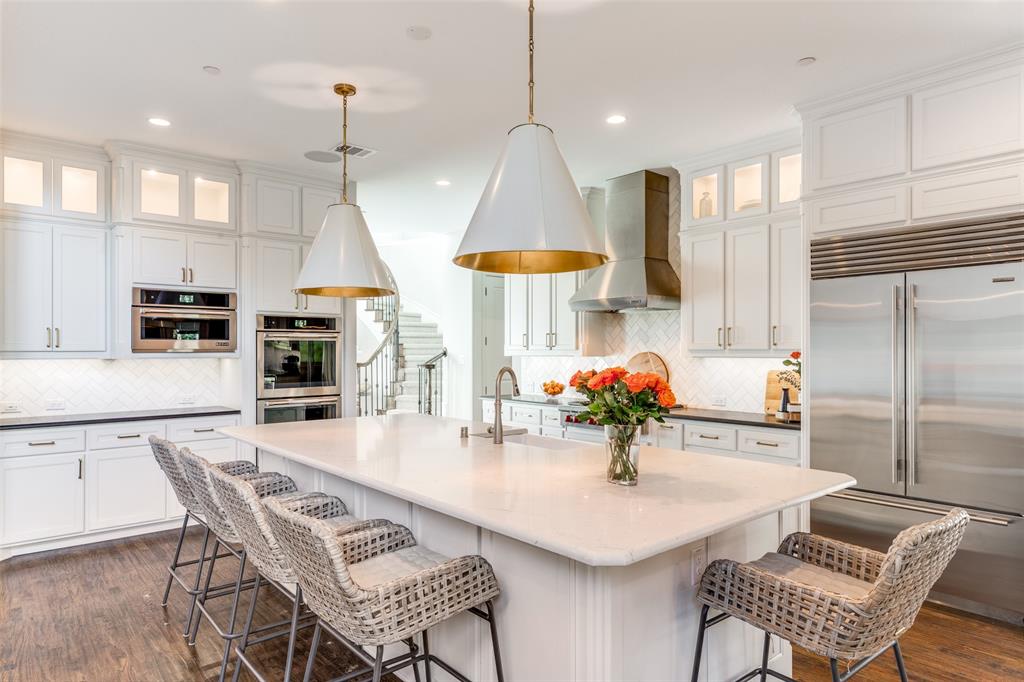 Step into unparalleled luxury at 808 Charleston Drive in Southlake, Texas. This exquisite custom Toll Brothers home offers 5 bedrooms, 5.5 baths, and a layout designed for both comfort and today's active family life. The main level boasts not one, but two spacious suites, perfect for multi-generational living or hosting with ease. Upstairs, three additional suite-style bedrooms provide privacy and convenience for family and guests alike. With three distinct living areas, including a game room featuring stunning custom built-ins, there’s no shortage of space to relax, entertain, or make memories. The heart of the home is the chef’s kitchen with professional series built-in appliances, seamlessly flowing into open-concept living spaces bathed in natural light. Retreat to the primary suite, where a cozy sitting area and spa-like bath await. Luxuriate in his-and-her closets, dual vanities, and a separate tub and shower—every detail designed for indulgence. Outside, your private backyard oasis awaits. Dive into the Claffey-designed pool and spa, grill up dinner in the outdoor kitchen under the oversized covered patio, or unwind while watching the game on the outdoor TV. The turf yard requires minimal upkeep, leaving plenty of time to hone your skills on the putting green or enjoy a match on the lighted sport court. It’s a haven for relaxation and recreation. The oversized 3-car garage, complete with built-in storage and an organized slat wall system is a car lovers or tinkerer's dream. Every inch of this home has been meticulously crafted to meet your needs while exceeding your expectations.