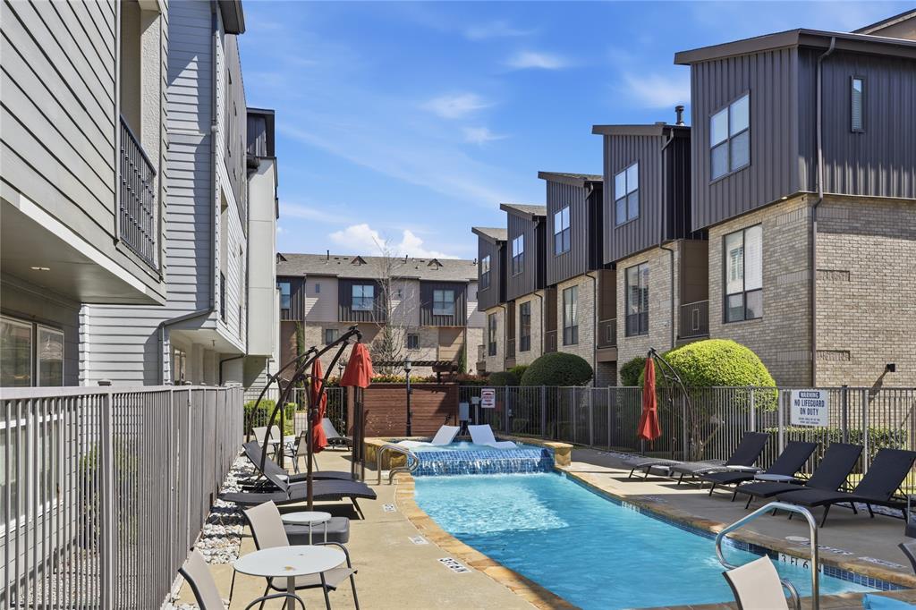 Stunning end-unit townhome in the heart of Oak Lawn, ideally located just minutes from the Katy Trail, Uptown, Downtown Dallas, the Medical District, Design District, and some of the city's best dining, shopping, and nightlife. Offering exceptional natural light with additional windows throughout and one of the most desirable locations in the community, this beautifully updated 2-bedroom plus study residence combines modern luxury with a highly sought-after lock-and-leave lifestyle.

The largest gated front yard in the complex provides an ideal private outdoor space for entertaining, pets, or everyday enjoyment. The first-floor bedroom features hardwood floors and an updated ensuite bath, offering flexibility for guests, a roommate, or a dedicated home office.

Designed for both comfortable living and entertaining, the open-concept second level showcases a gas fireplace, private balcony, abundant natural light, and a timeless kitchen complete with granite countertops, a large island, white cabinetry, and stainless steel appliances, including a gas range.

The third floor is dedicated to a built-in Ligne Roset study and an oversized primary retreat featuring multiple closets and a fully renovated spa-inspired bath with a Victoria + Albert volcanic limestone soaking tub, Porcelanosa tile, Toto toilet, oversized shower, floating cabinetry with quartz countertops, and Robern AiO lighted medicine cabinets.

Additional upgrades include fresh paint, a Navien tankless water heater, curated designer lighting by Santa & Cole, Jonathan Adler and VIPP, Hansgrohe fixtures throughout, and a recently replaced roof (2024). Located in one of the few Oak Lawn communities with a pool and outdoor grilling area, this exceptional residence offers luxury finishes, private outdoor living, and unmatched access to some of Dallas' most desirable destinations.